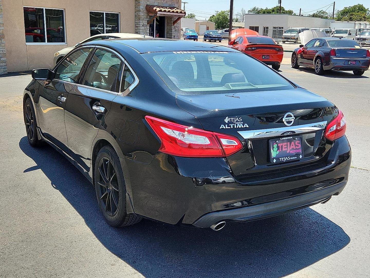 2016 Super Black Nissan Altima 2.5 S (1N4AL3AP0GC) with an 2.5L I-4 DOHC, variable valve control, regular unleaded, engine with 182HP engine, located at 4110 Avenue Q, Lubbock, 79412, 33.556553, -101.855820 - Photo#2