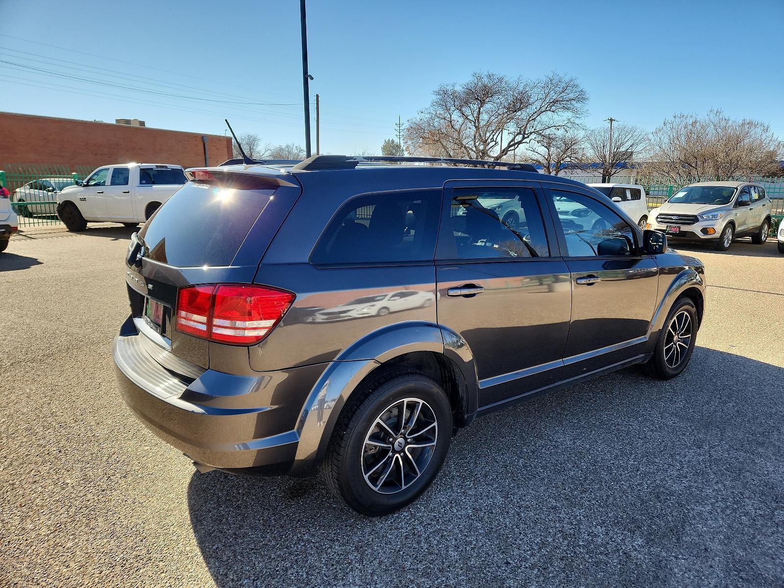 2018 GRAY /BLACK Dodge Journey (3C4PDCAB4JT) with an 2.4L I4 DOHC 16V Dual VVT engine, 4-SPEED AUTOMATIC VLP transmission, located at 3701 Avenue Q, Lubbock, 79412, 33.560417, -101.855019 - Photo #1