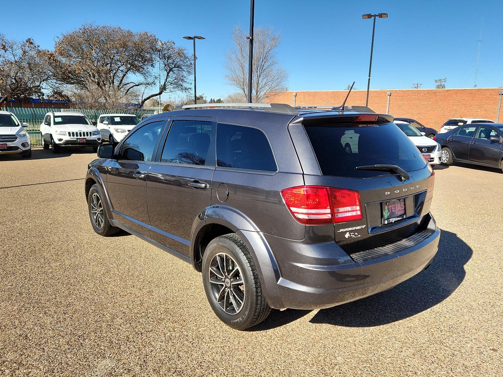 2018 GRAY /BLACK Dodge Journey (3C4PDCAB4JT) with an 2.4L I4 DOHC 16V Dual VVT engine, 4-SPEED AUTOMATIC VLP transmission, located at 3701 Avenue Q, Lubbock, 79412, 33.560417, -101.855019 - Photo #2