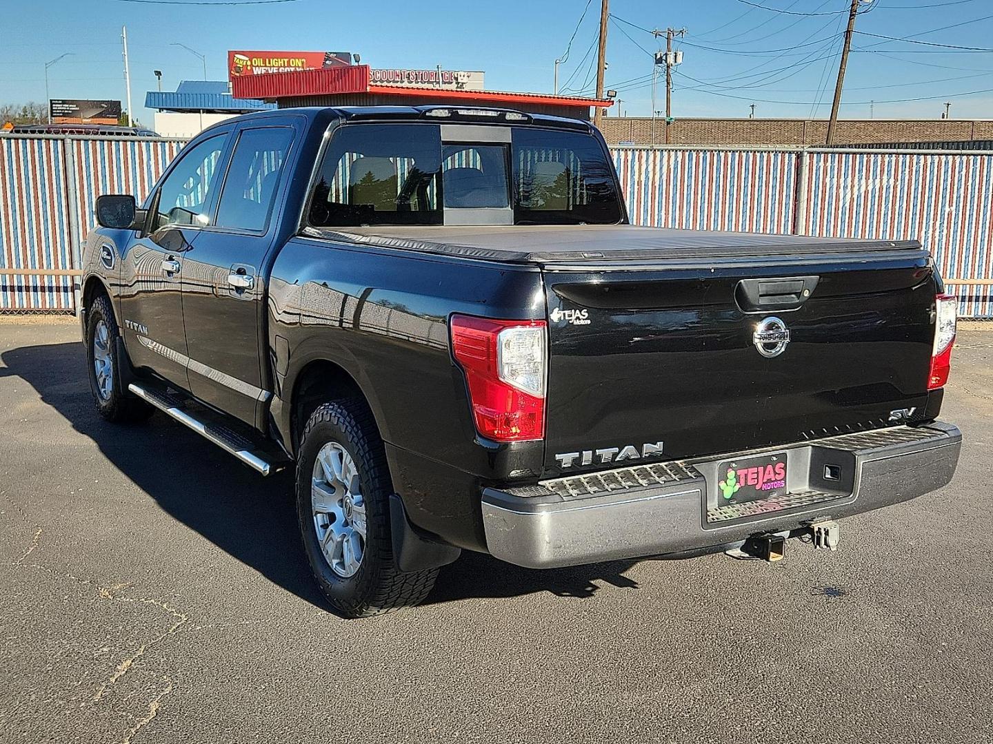 2017 Magnetic Black Nissan TITAN SV (1N6AA1EK2HN) with an Endurance 5.6L V-8 gasoline direct injection, VVEL DOHC, variable valve control, regular unleaded, engine with 390HP engine, located at 4110 Avenue Q, Lubbock, 79412, 33.556553, -101.855820 - Photo#2