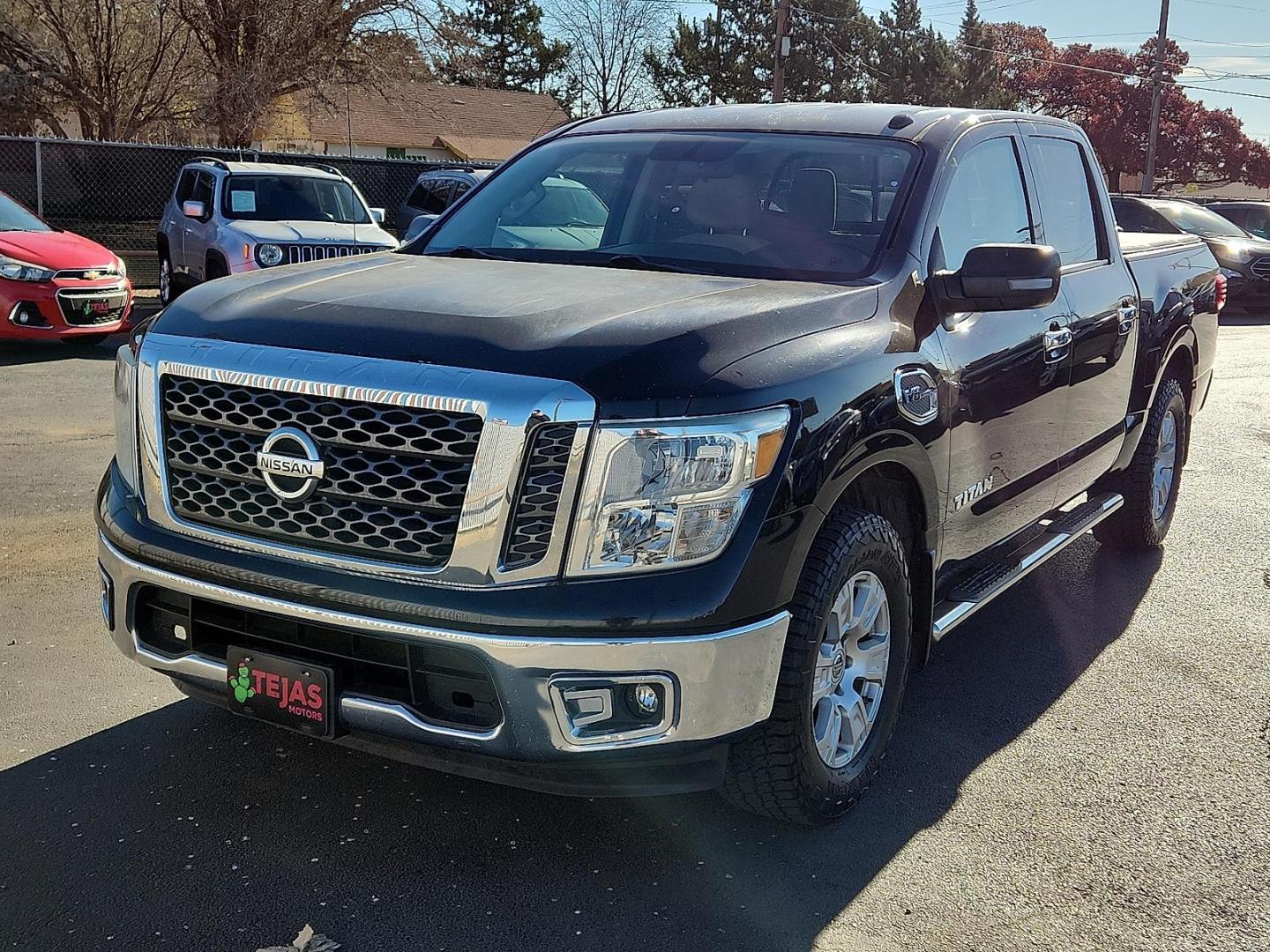 2017 Magnetic Black Nissan TITAN SV (1N6AA1EK2HN) with an Endurance 5.6L V-8 gasoline direct injection, VVEL DOHC, variable valve control, regular unleaded, engine with 390HP engine, located at 4110 Avenue Q, Lubbock, 79412, 33.556553, -101.855820 - Photo#3