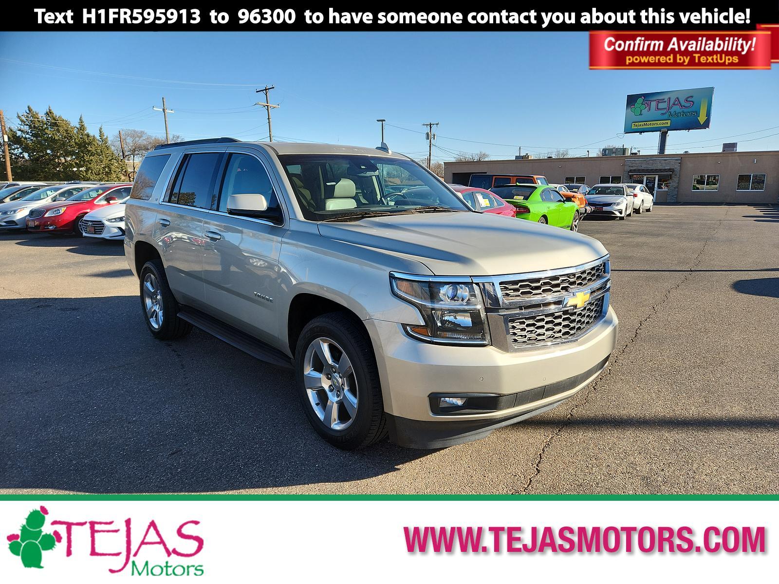 2015 Champagne Silver Metallic /Cocoa/Dune Chevrolet Tahoe LT (1GNSCBKC5FR) with an ENGINE, 5.3L ECOTEC3 V8 WITH ACTIVE FUEL MANAGEMENT, DIRECT INJECTION AND VARIABLE VALVE TIMING engine, located at 4110 Avenue Q, Lubbock, 79412, 33.556553, -101.855820 - Photo #0