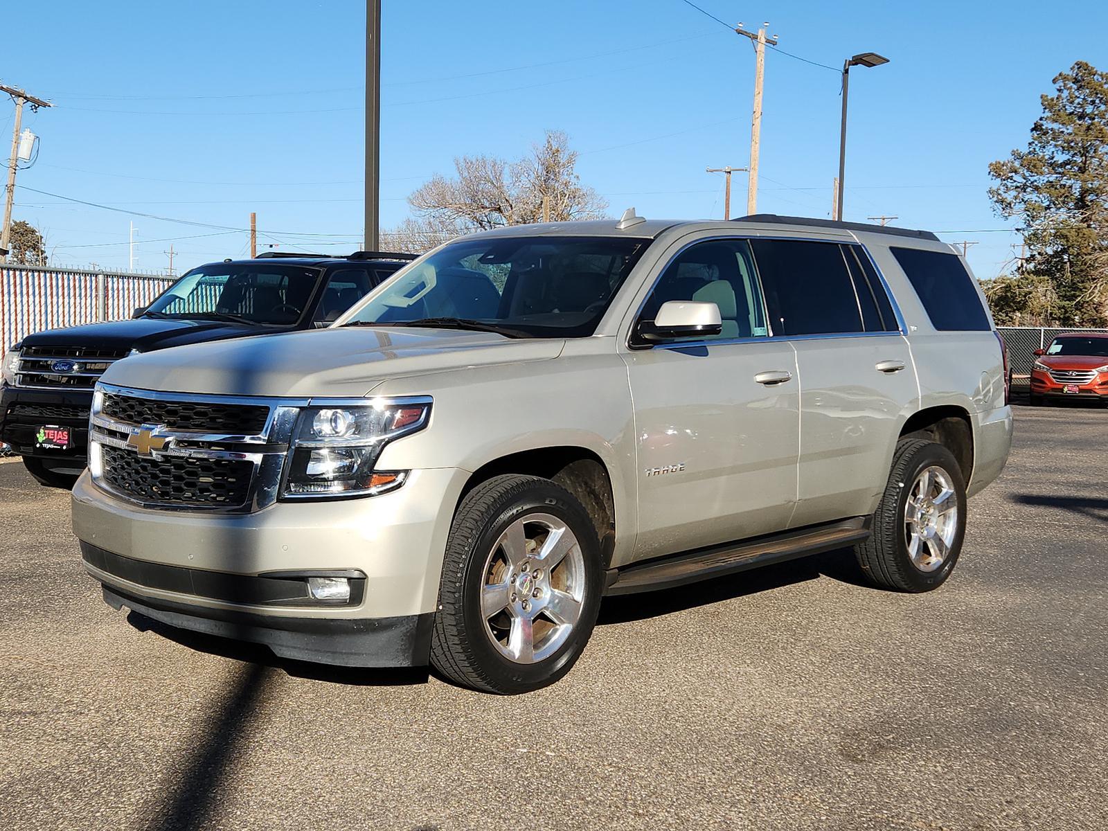 2015 Champagne Silver Metallic /Cocoa/Dune Chevrolet Tahoe LT (1GNSCBKC5FR) with an ENGINE, 5.3L ECOTEC3 V8 WITH ACTIVE FUEL MANAGEMENT, DIRECT INJECTION AND VARIABLE VALVE TIMING engine, located at 4110 Avenue Q, Lubbock, 79412, 33.556553, -101.855820 - Photo #1