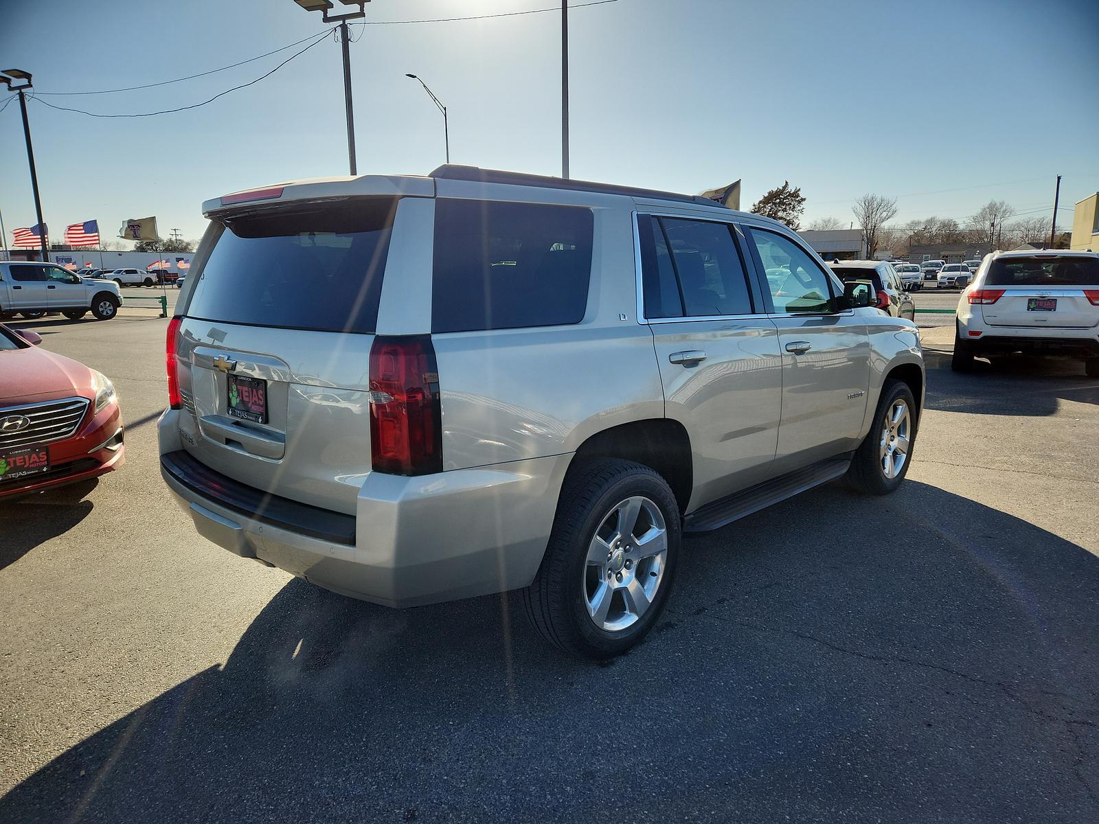 2015 Champagne Silver Metallic /Cocoa/Dune Chevrolet Tahoe LT (1GNSCBKC5FR) with an ENGINE, 5.3L ECOTEC3 V8 WITH ACTIVE FUEL MANAGEMENT, DIRECT INJECTION AND VARIABLE VALVE TIMING engine, located at 4110 Avenue Q, Lubbock, 79412, 33.556553, -101.855820 - Photo #3