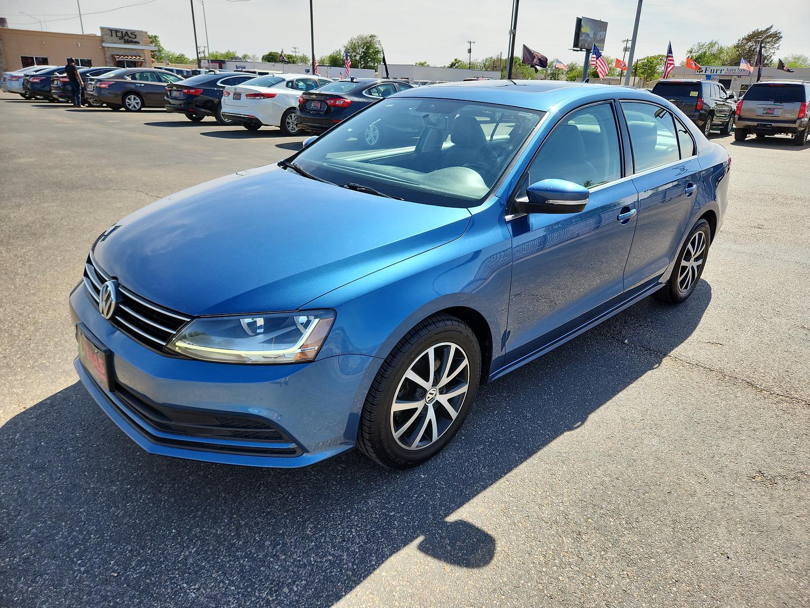 2017 BLUE Volkswagen Jetta 1.4T SE (3VWDB7AJ2HM) with an Engine: 1.4L TSI I-4 Turbocharged -inc: DOHC 16-valve, direct injection engine, located at 4110 Avenue Q, Lubbock, 79412, 33.556553, -101.855820 - Photo #3