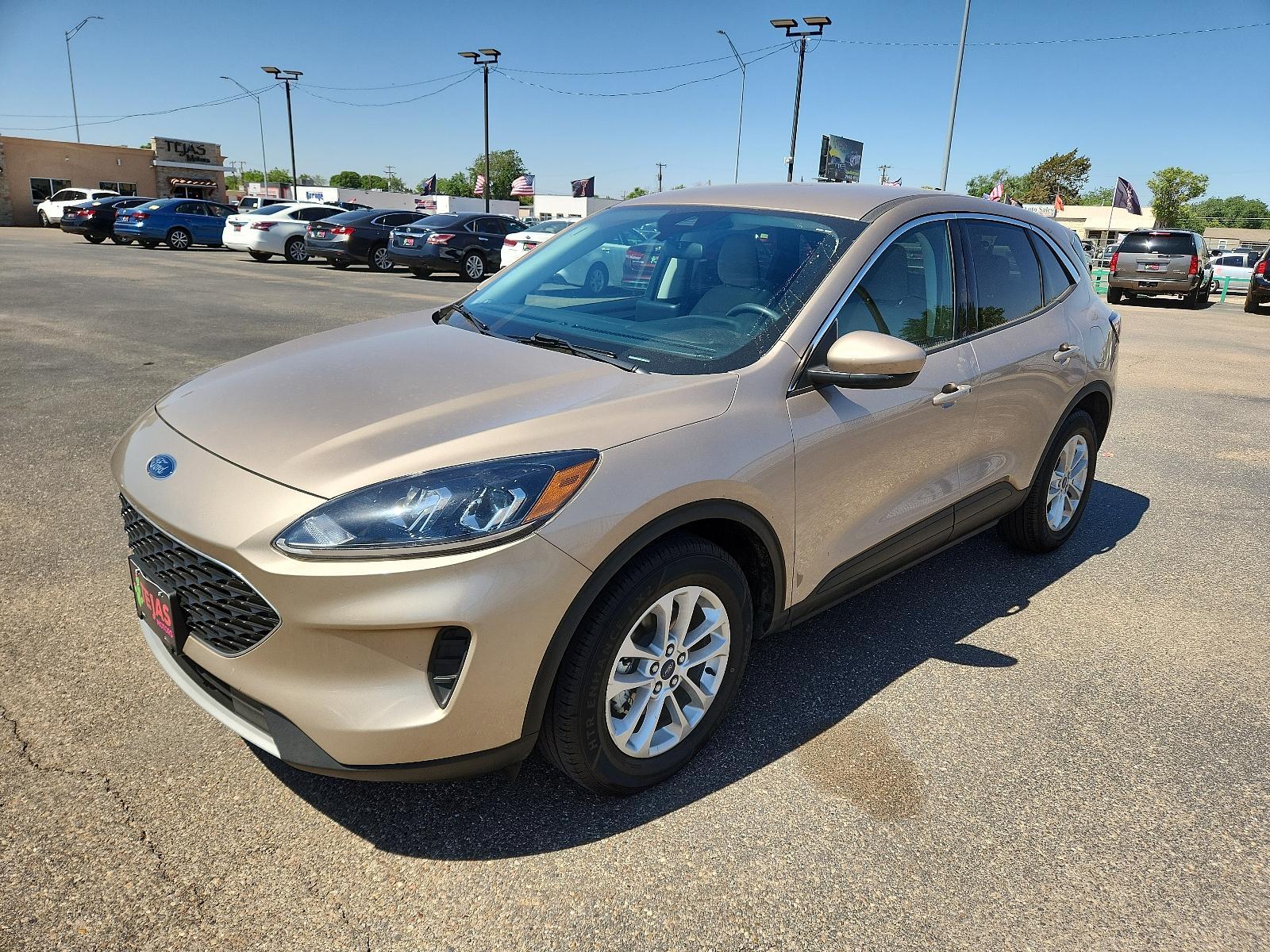 2021 GOLD Ford Escape SE Hybrid (1FMCU0BZ6MU) with an ENGINE: 2.5L IVCT ATKINSON CYCLE I-4 HYBRID engine, located at 4110 Avenue Q, Lubbock, 79412, 33.556553, -101.855820 - 05/05/2023 KEY INENVELOPE GOD - Photo #3