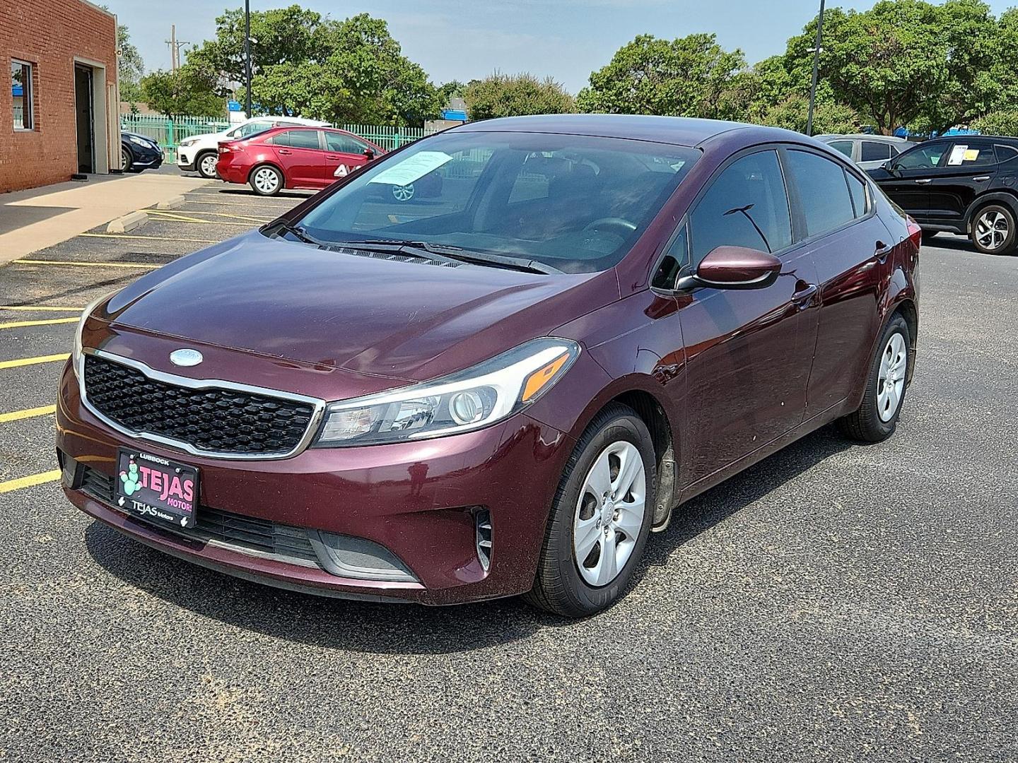 2017 Garnet Red - B4N /Black - WK Kia Forte LX (3KPFK4A74HE) with an 2L I-4 DOHC, D-CVVT variable valve control, regular unleaded, engine with 147HP engine, located at 4110 Avenue Q, Lubbock, 79412, 33.556553, -101.855820 - Photo#4