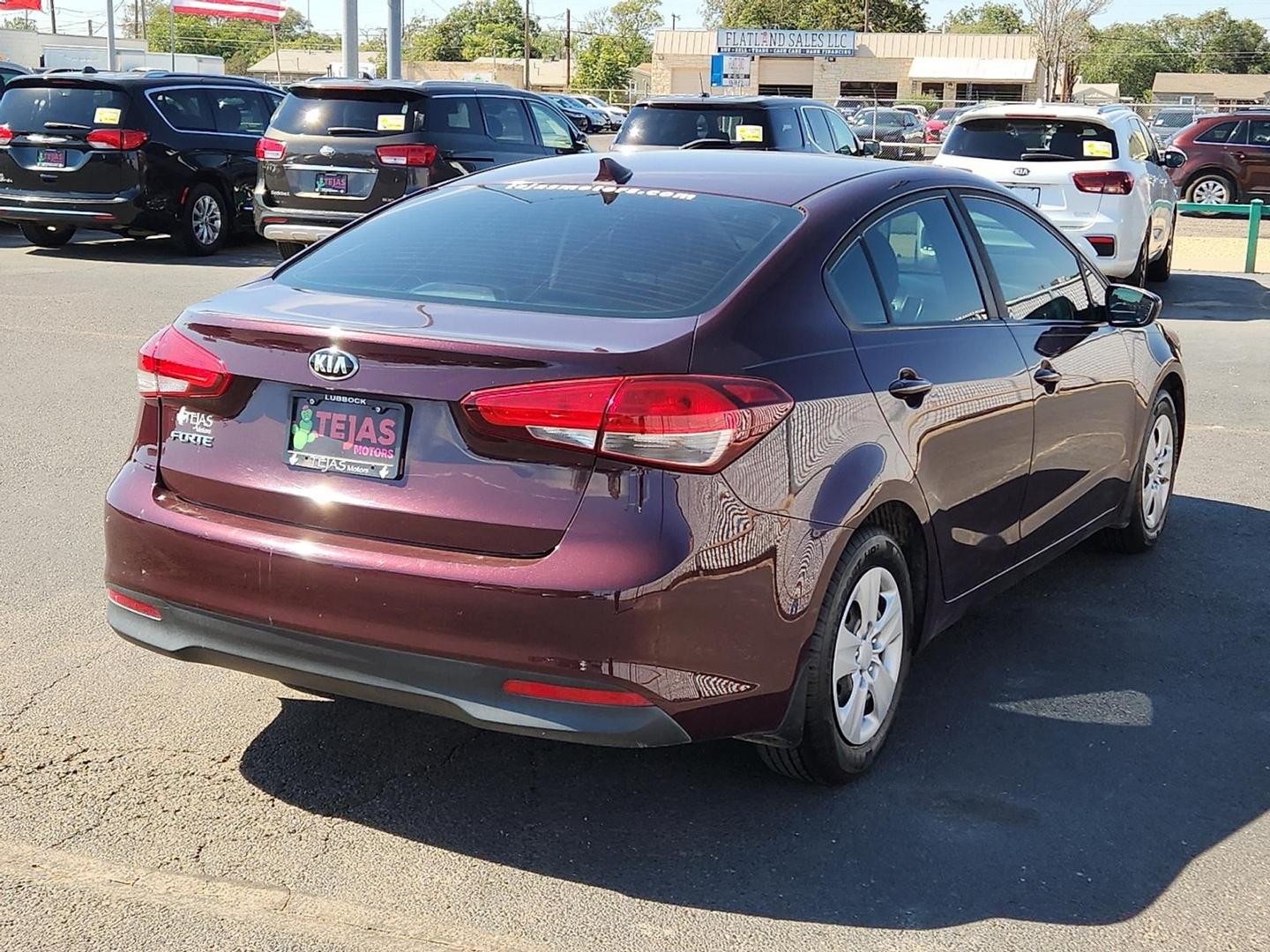 2017 Garnet Red - B4N /Black - WK Kia Forte LX (3KPFK4A74HE) with an 2L I-4 DOHC, D-CVVT variable valve control, regular unleaded, engine with 147HP engine, located at 4110 Avenue Q, Lubbock, 79412, 33.556553, -101.855820 - Photo#1