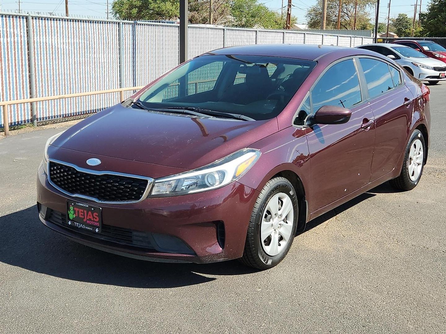 2017 Garnet Red - B4N /Black - WK Kia Forte LX (3KPFK4A74HE) with an 2L I-4 DOHC, D-CVVT variable valve control, regular unleaded, engine with 147HP engine, located at 4110 Avenue Q, Lubbock, 79412, 33.556553, -101.855820 - Photo#3