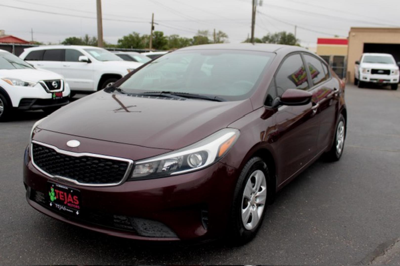 2017 Garnet Red - B4N /Black - WK Kia Forte LX (3KPFK4A74HE) with an 2L I-4 DOHC, D-CVVT variable valve control, regular unleaded, engine with 147HP engine, located at 4110 Avenue Q, Lubbock, 79412, 33.556553, -101.855820 - 11/12/2025 KEY IN ENVELOPE GOD- Photo#1
