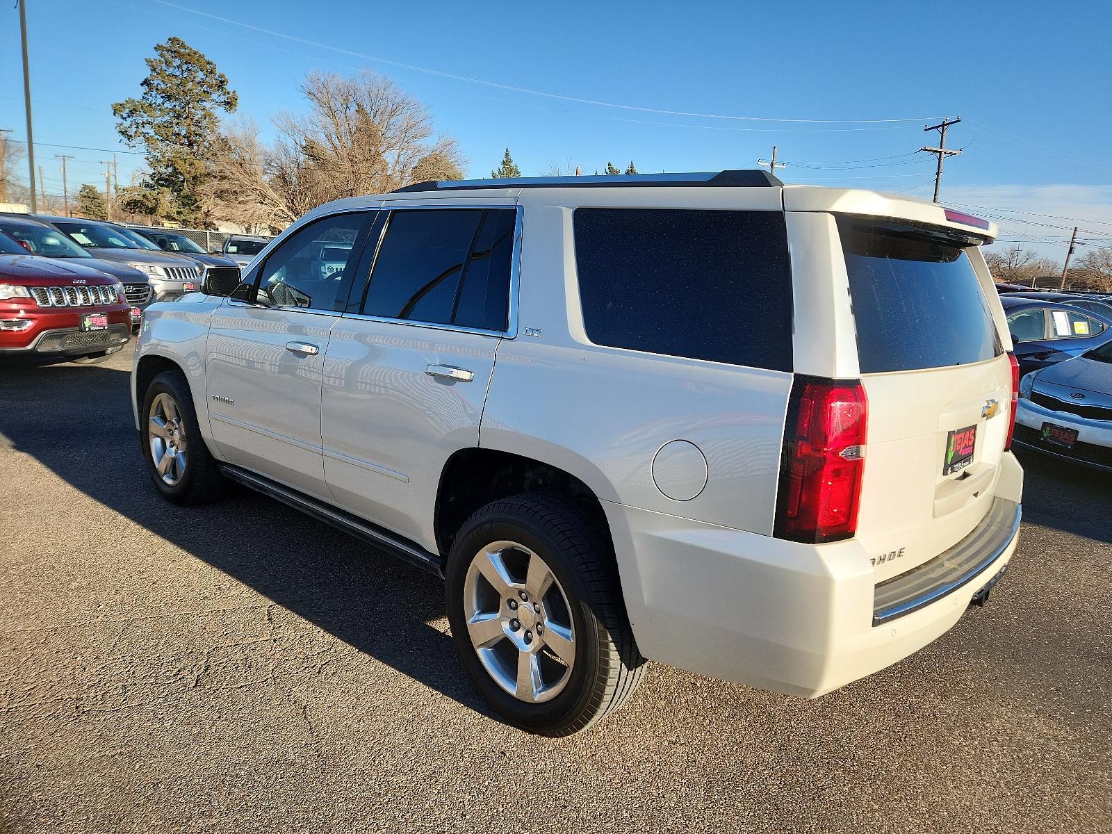2015 WHTIE Chevrolet Tahoe LTZ (1GNSCCKC6FR) with an ENGINE, 5.3L ECOTEC3 V8 WITH ACTIVE FUEL MANAGEMENT, DIRECT INJECTION AND VARIABLE VALVE TIMING engine, located at 4110 Avenue Q, Lubbock, 79412, 33.556553, -101.855820 - 02/02/2024 KEY AND INSPECTION IN ENVELOPE GOD - Photo #2