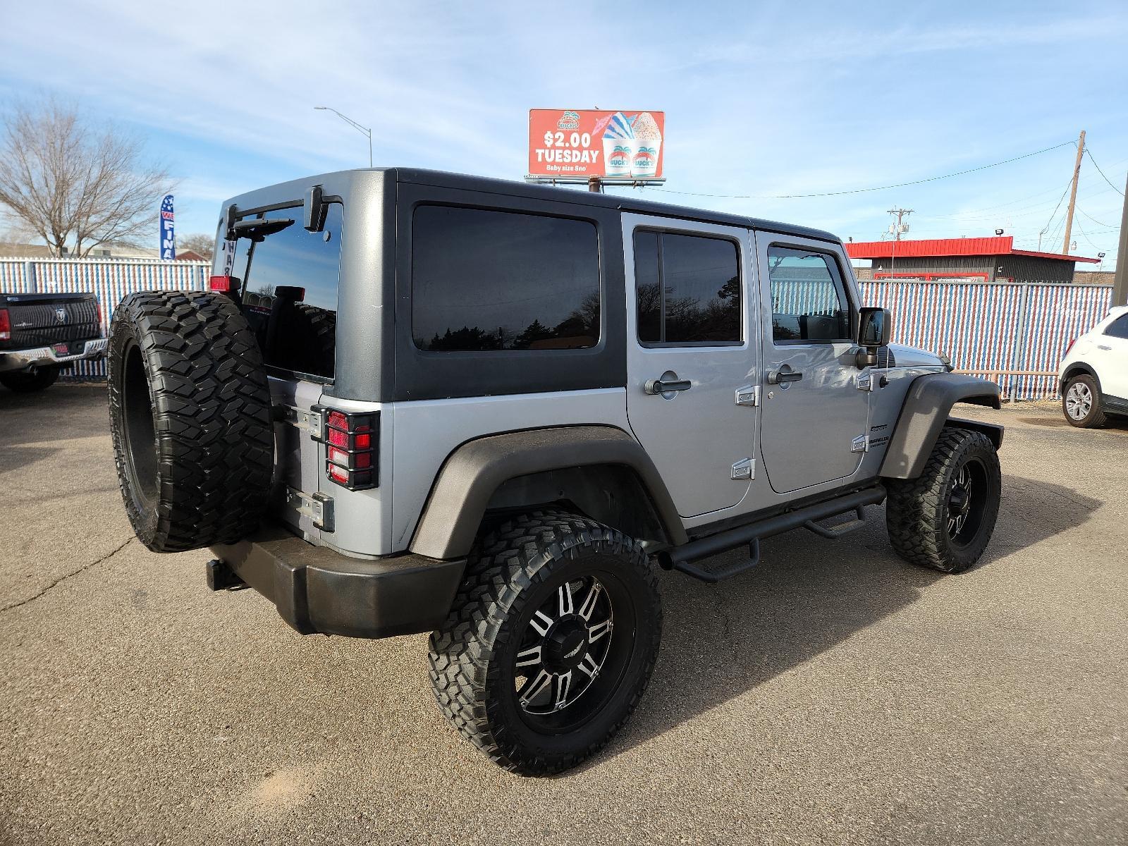 2013 SILVER Jeep Wrangler Unlimited Sport (1C4BJWDG3DL) with an 3.6L SMPI 24V VVT V6 ENGINE engine, located at 4110 Avenue Q, Lubbock, 79412, 33.556553, -101.855820 - Photo #1