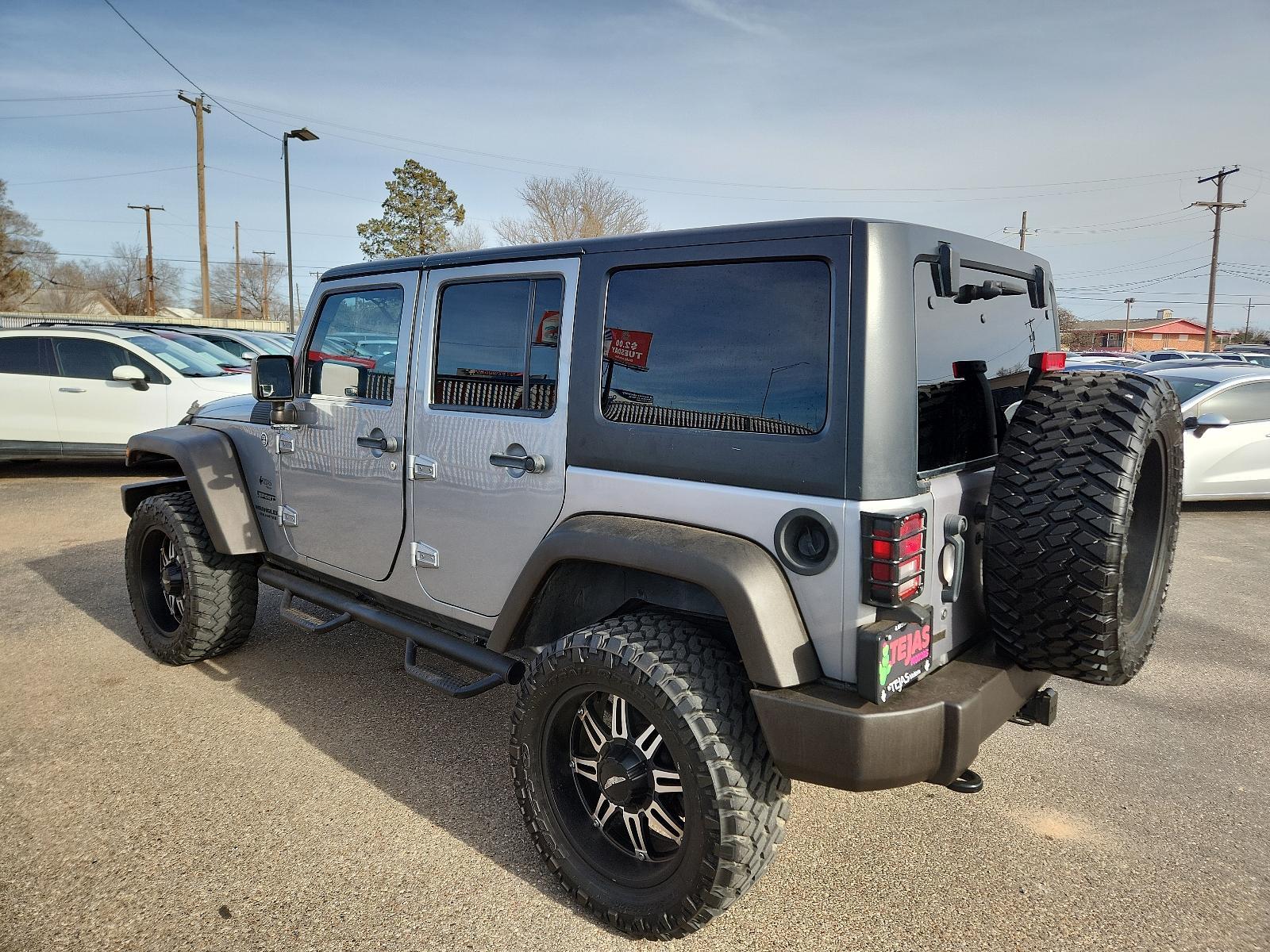 2013 SILVER Jeep Wrangler Unlimited Sport (1C4BJWDG3DL) with an 3.6L SMPI 24V VVT V6 ENGINE engine, located at 4110 Avenue Q, Lubbock, 79412, 33.556553, -101.855820 - Photo #2