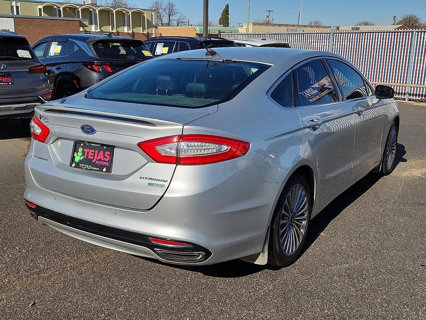 2016 Ingot Silver - UX /Charcoal Black - CW Ford Fusion Titanium (3FA6P0K93GR) with an EcoBoost 2L I-4 gasoline direct injection, DOHC, variable valve control, intercooled turbo, regular unleaded, engine with 231HP engine, located at 4110 Avenue Q, Lubbock, 79412, 33.556553, -101.855820 - Photo#1