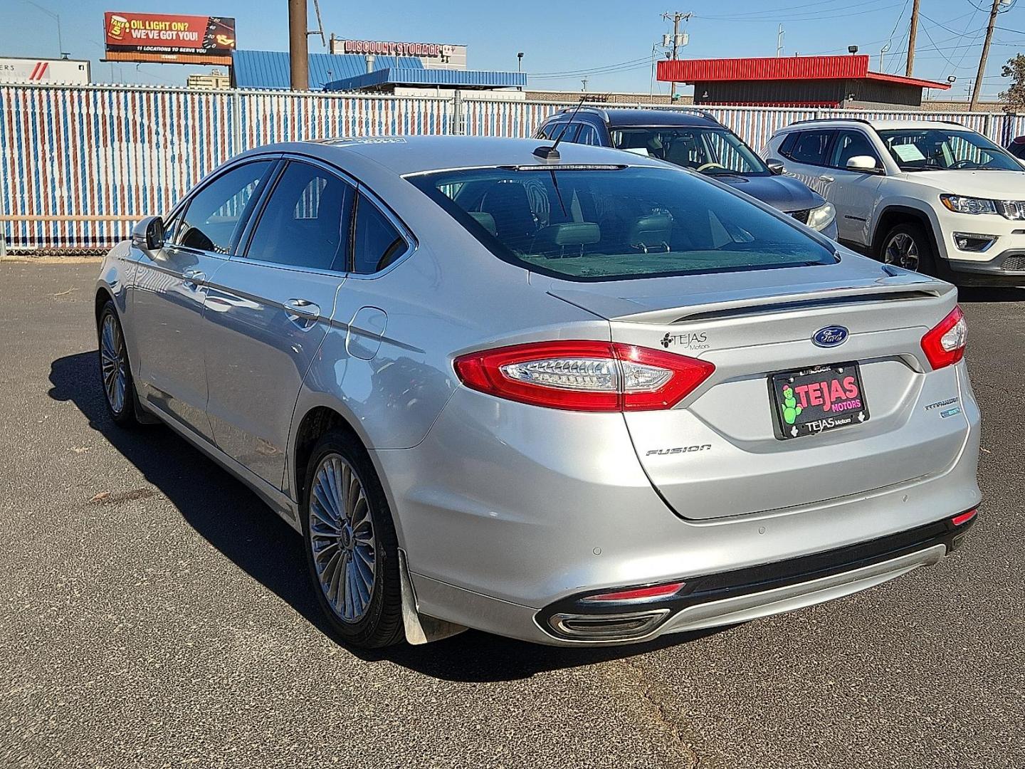 2016 Ingot Silver - UX /Charcoal Black - CW Ford Fusion Titanium (3FA6P0K93GR) with an EcoBoost 2L I-4 gasoline direct injection, DOHC, variable valve control, intercooled turbo, regular unleaded, engine with 231HP engine, located at 4110 Avenue Q, Lubbock, 79412, 33.556553, -101.855820 - Photo#2