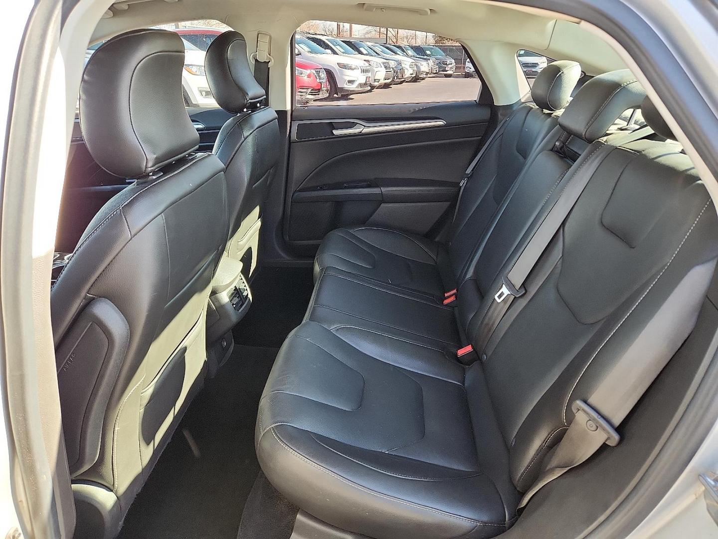 2016 Ingot Silver - UX /Charcoal Black - CW Ford Fusion Titanium (3FA6P0K93GR) with an EcoBoost 2L I-4 gasoline direct injection, DOHC, variable valve control, intercooled turbo, regular unleaded, engine with 231HP engine, located at 4110 Avenue Q, Lubbock, 79412, 33.556553, -101.855820 - Photo#4