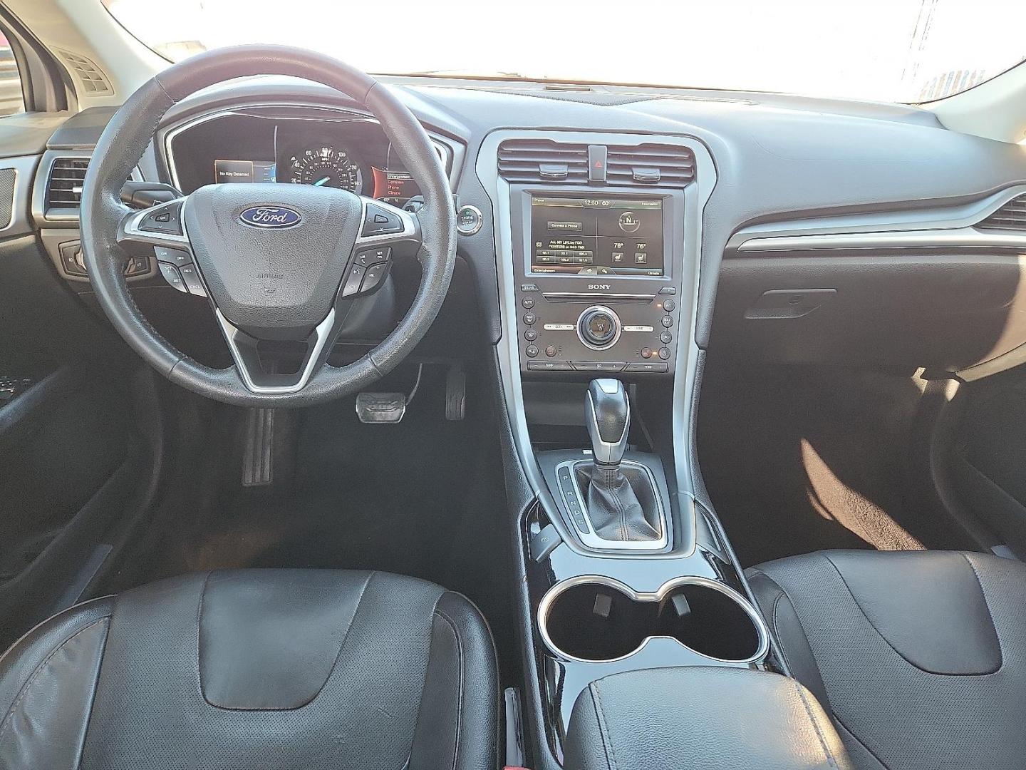 2016 Ingot Silver - UX /Charcoal Black - CW Ford Fusion Titanium (3FA6P0K93GR) with an EcoBoost 2L I-4 gasoline direct injection, DOHC, variable valve control, intercooled turbo, regular unleaded, engine with 231HP engine, located at 4110 Avenue Q, Lubbock, 79412, 33.556553, -101.855820 - Photo#5