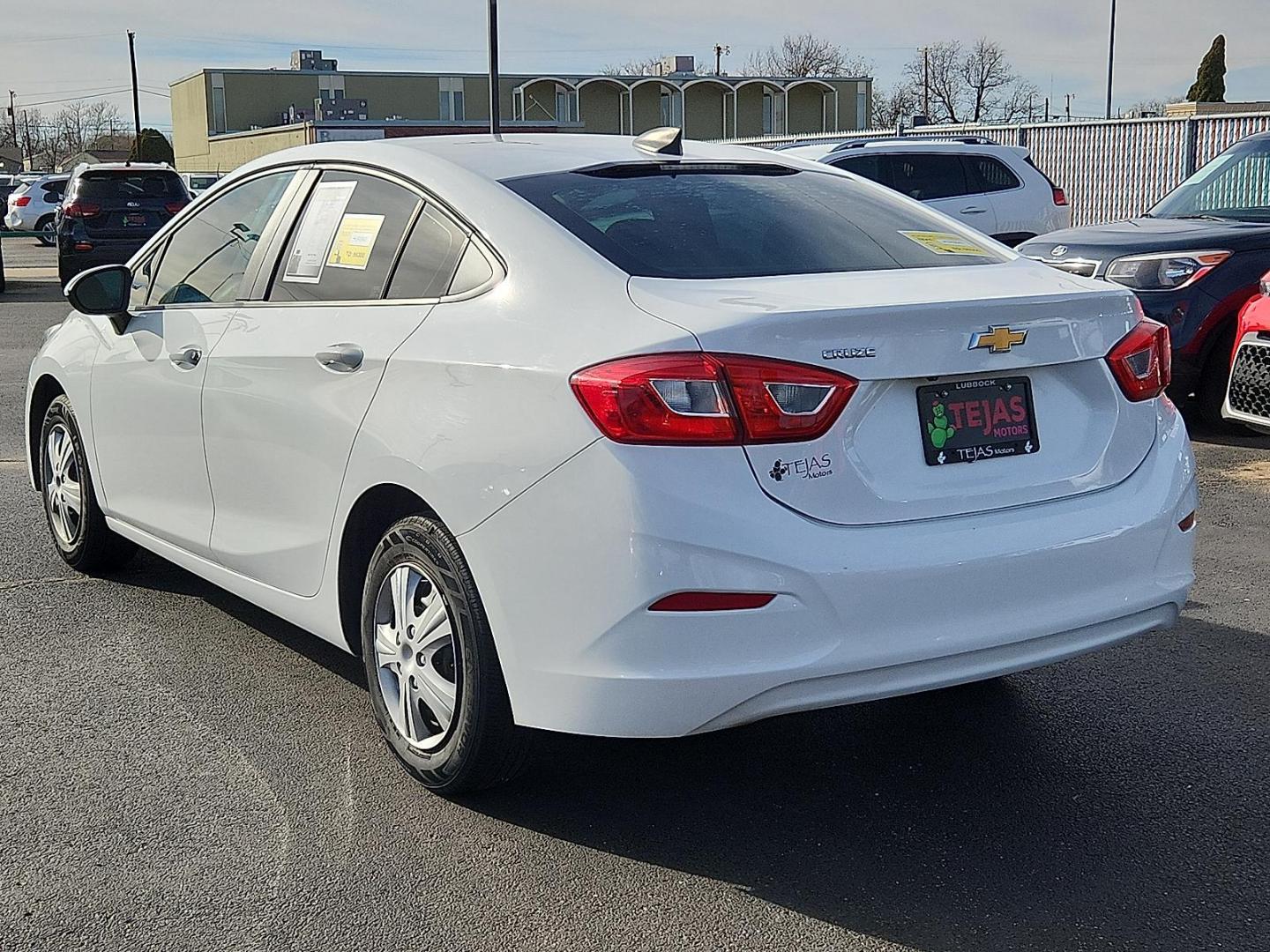 2019 WHITE /Grey Chevrolet Cruze LS (1G1BC5SM4K7) with an 1.4L I-4 gasoline direct injection, DOHC, VVT variable valve control, intercooled turbo, regular unleaded, engine with 153HP engine, located at 4110 Avenue Q, Lubbock, 79412, 33.556553, -101.855820 - Photo#2