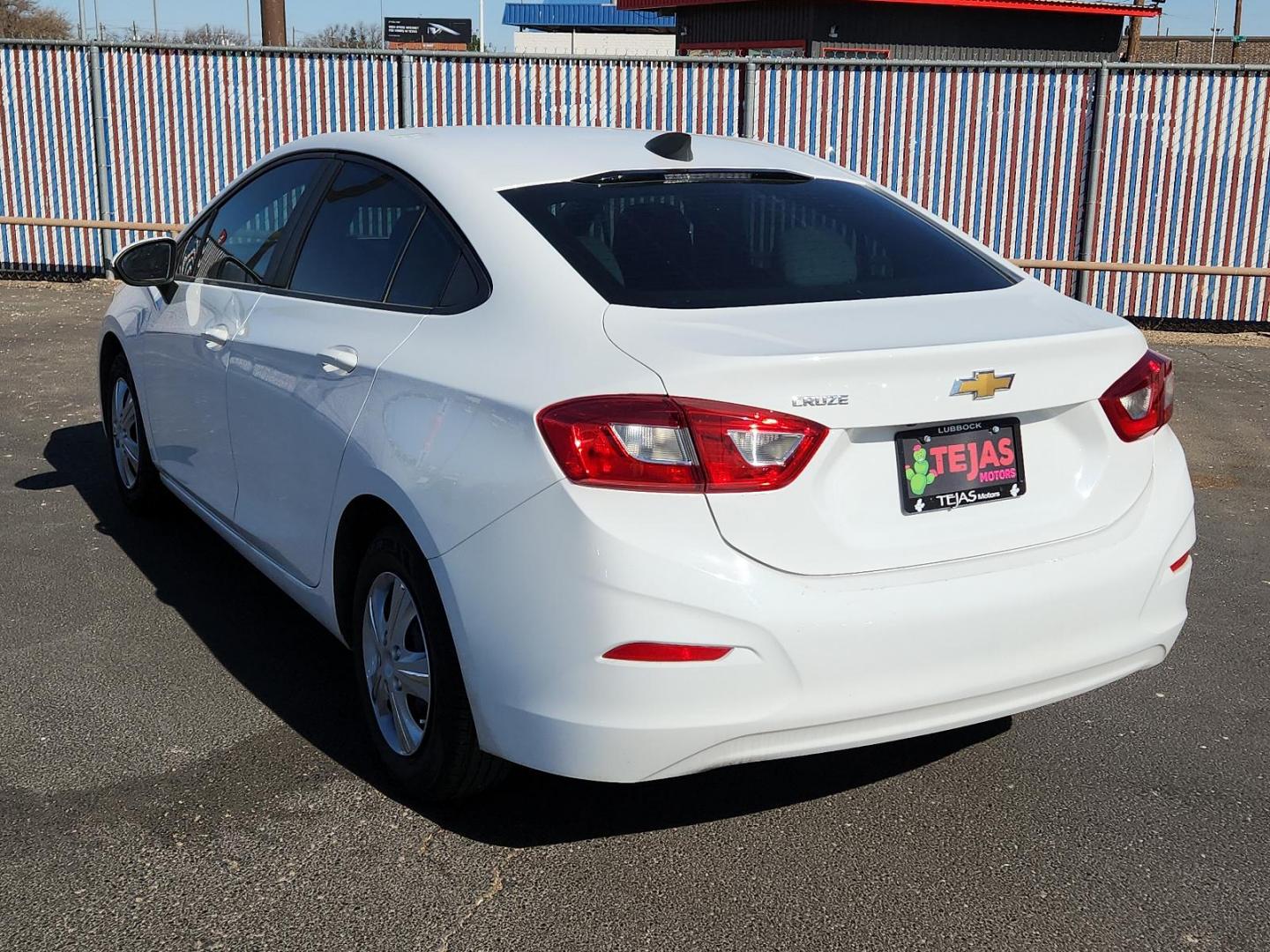 2019 WHITE Chevrolet Cruze LS (1G1BC5SM4K7) with an 1.4L I-4 gasoline direct injection, DOHC, VVT variable valve control, intercooled turbo, regular unleaded, engine with 153HP engine, located at 4110 Avenue Q, Lubbock, 79412, 33.556553, -101.855820 - Photo#2