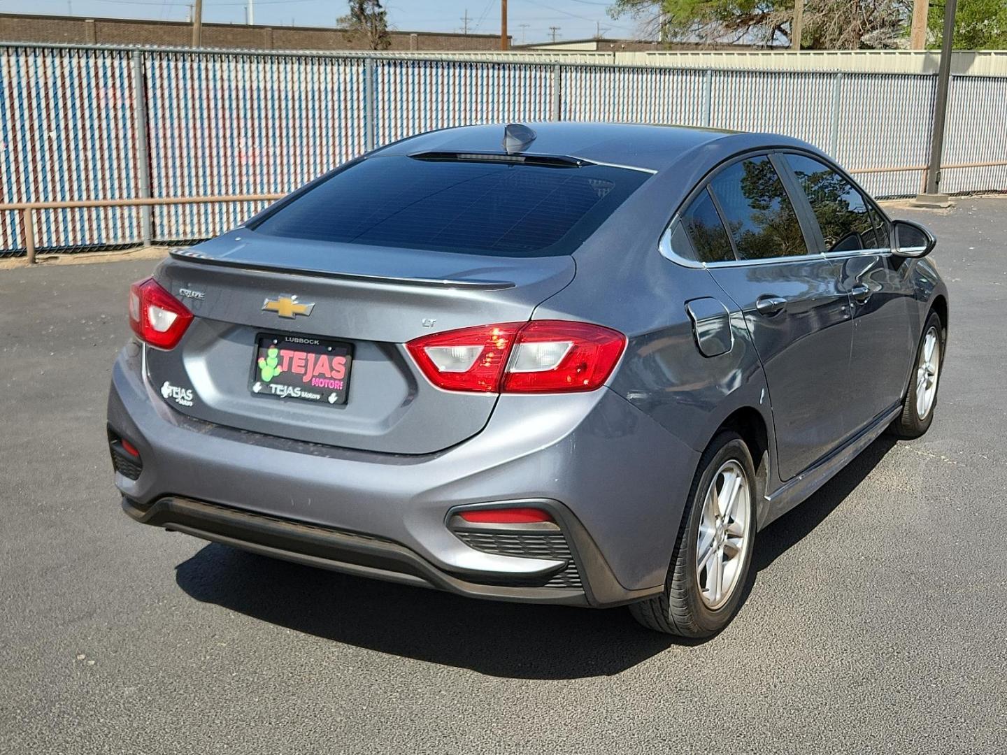 2018 GRAY Chevrolet Cruze LT Auto (1G1BE5SM1J7) with an 1.4L I-4 gasoline direct injection, DOHC, variable valve control, intercooled turbo, regular unleaded, engine with 153HP engine, located at 4110 Avenue Q, Lubbock, 79412, 33.556553, -101.855820 - 03/29/2025 KEY IN ENVELOPE GOD - Photo#1