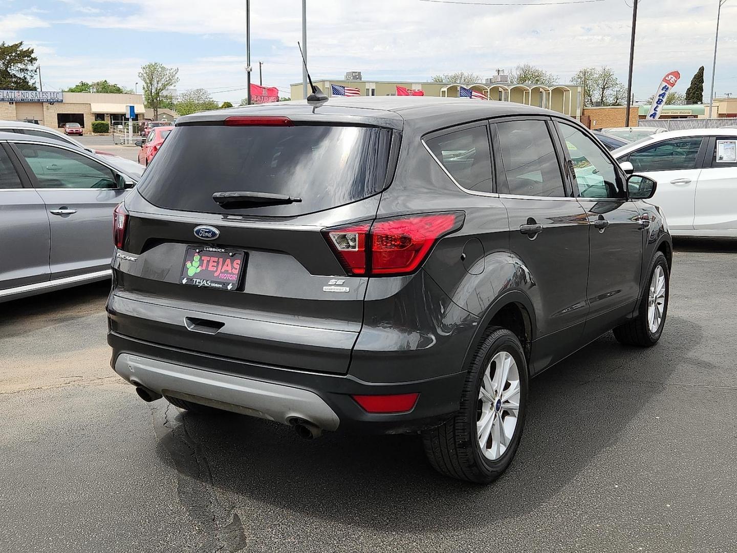 2019 GRAY Ford Escape SE (1FMCU0GDXKU) with an EcoBoost 1.5L I-4 gasoline direct injection, DOHC, iVCT variable valve control, intercooled turbo, regular unleaded, engine with 179HP engine, located at 4110 Avenue Q, Lubbock, 79412, 33.556553, -101.855820 - 04/10/2025 KEY IN ENVELOPE GOD - Photo#1