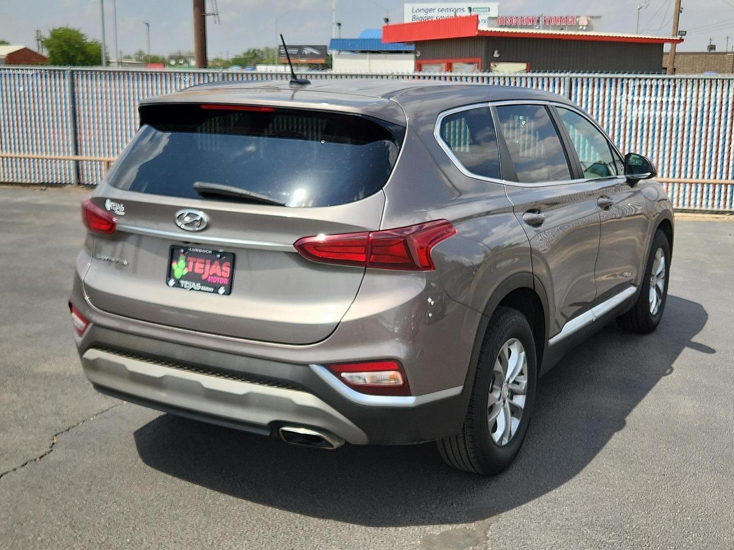 2019 BROWN Hyundai Santa Fe SE (5NMS23AD8KH) with an Theta II 2.4L I-4 gasoline direct injection, DOHC, D-CVVT variable valve control, regular unleaded, engine with 185HP engine, located at 4110 Avenue Q, Lubbock, 79412, 33.556553, -101.855820 - 04/18/2025 KEY IN ENVELOPE GOD - Photo#1