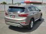 2019 BROWN Hyundai Santa Fe SE (5NMS23AD8KH) with an Theta II 2.4L I-4 gasoline direct injection, DOHC, D-CVVT variable valve control, regular unleaded, engine with 185HP engine, located at 4110 Avenue Q, Lubbock, 79412, 33.556553, -101.855820 - 04/18/2025 KEY IN ENVELOPE GOD - Photo#1