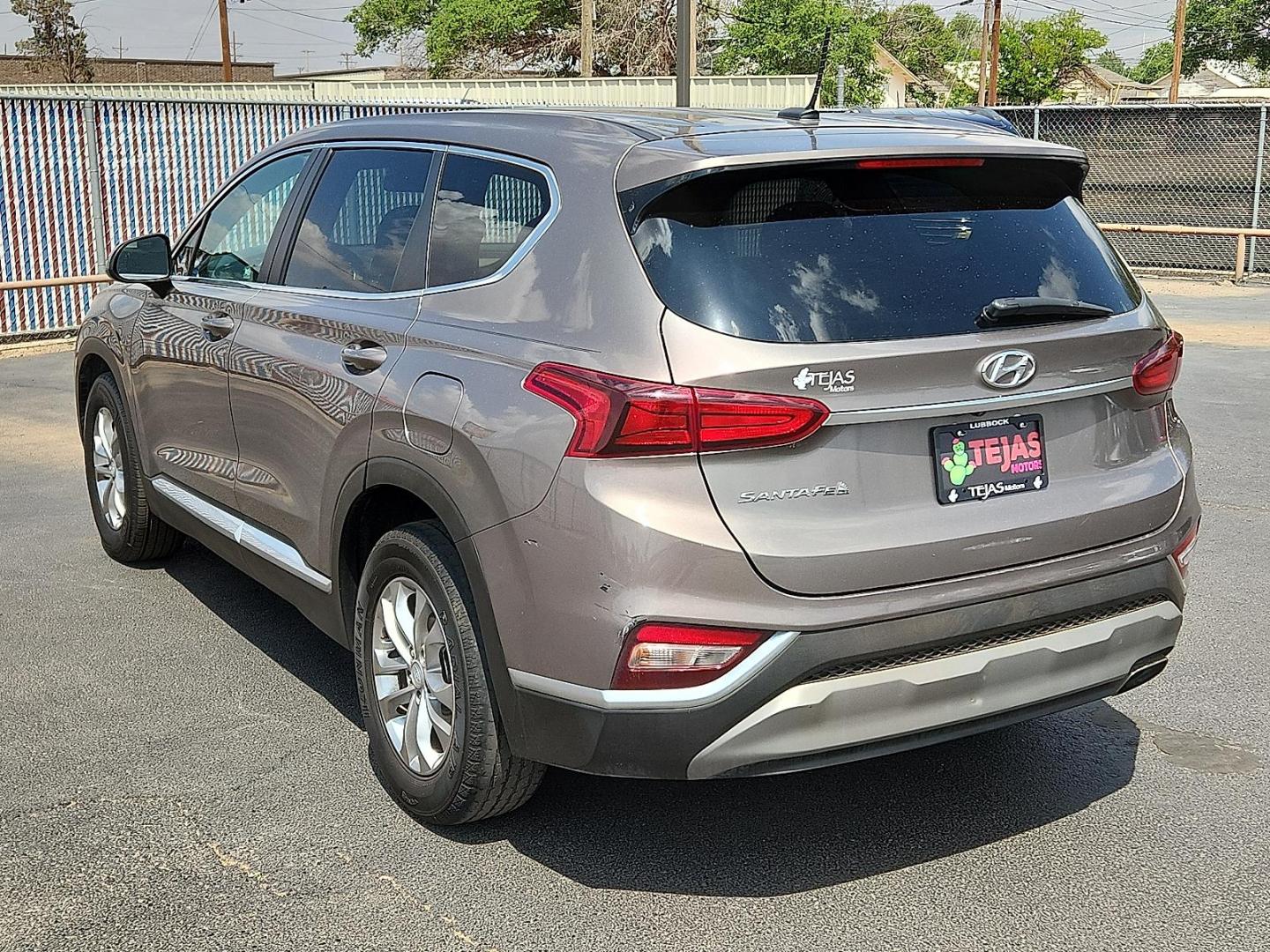 2019 BROWN Hyundai Santa Fe SE (5NMS23AD8KH) with an Theta II 2.4L I-4 gasoline direct injection, DOHC, D-CVVT variable valve control, regular unleaded, engine with 185HP engine, located at 4110 Avenue Q, Lubbock, 79412, 33.556553, -101.855820 - 04/18/2025 KEY IN ENVELOPE GOD - Photo#2