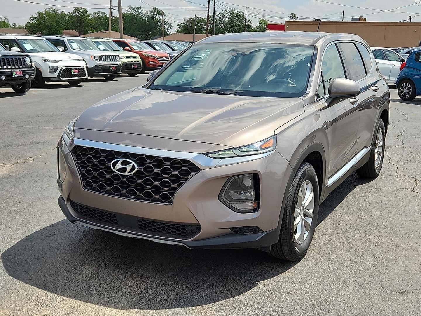 2019 BROWN Hyundai Santa Fe SE (5NMS23AD8KH) with an Theta II 2.4L I-4 gasoline direct injection, DOHC, D-CVVT variable valve control, regular unleaded, engine with 185HP engine, located at 4110 Avenue Q, Lubbock, 79412, 33.556553, -101.855820 - 04/18/2025 KEY IN ENVELOPE GOD - Photo#3