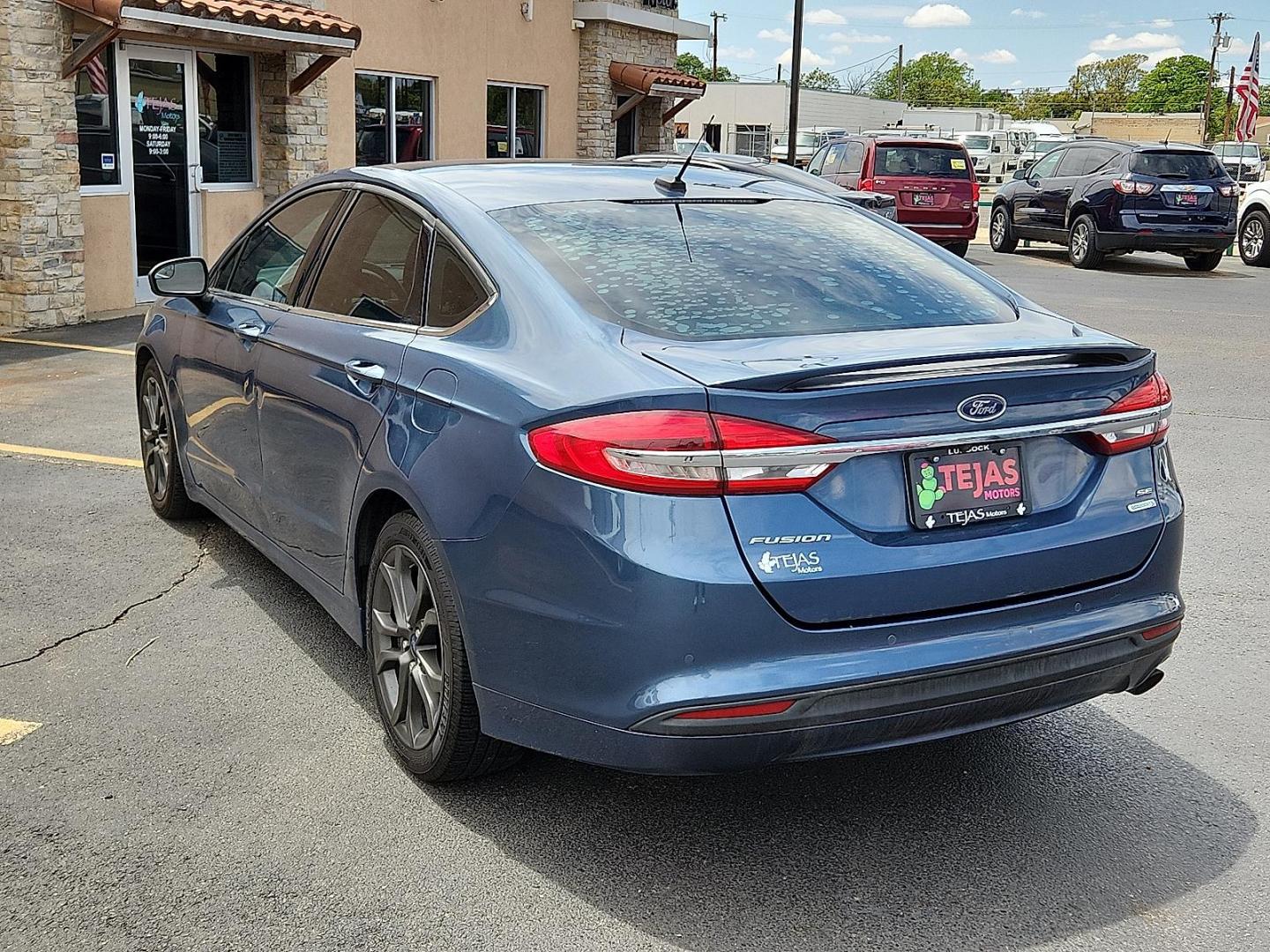 2018 BLUE Ford Fusion SE (3FA6P0HDXJR) with an EcoBoost 1.5L I-4 gasoline direct injection, DOHC, Ti-VCT variable valve control, intercooled turbo, regular unleaded, engine with 181HP engine, located at 4110 Avenue Q, Lubbock, 79412, 33.556553, -101.855820 - 04/29/2025 KEY IN ENVELOPE GOD - Photo#2