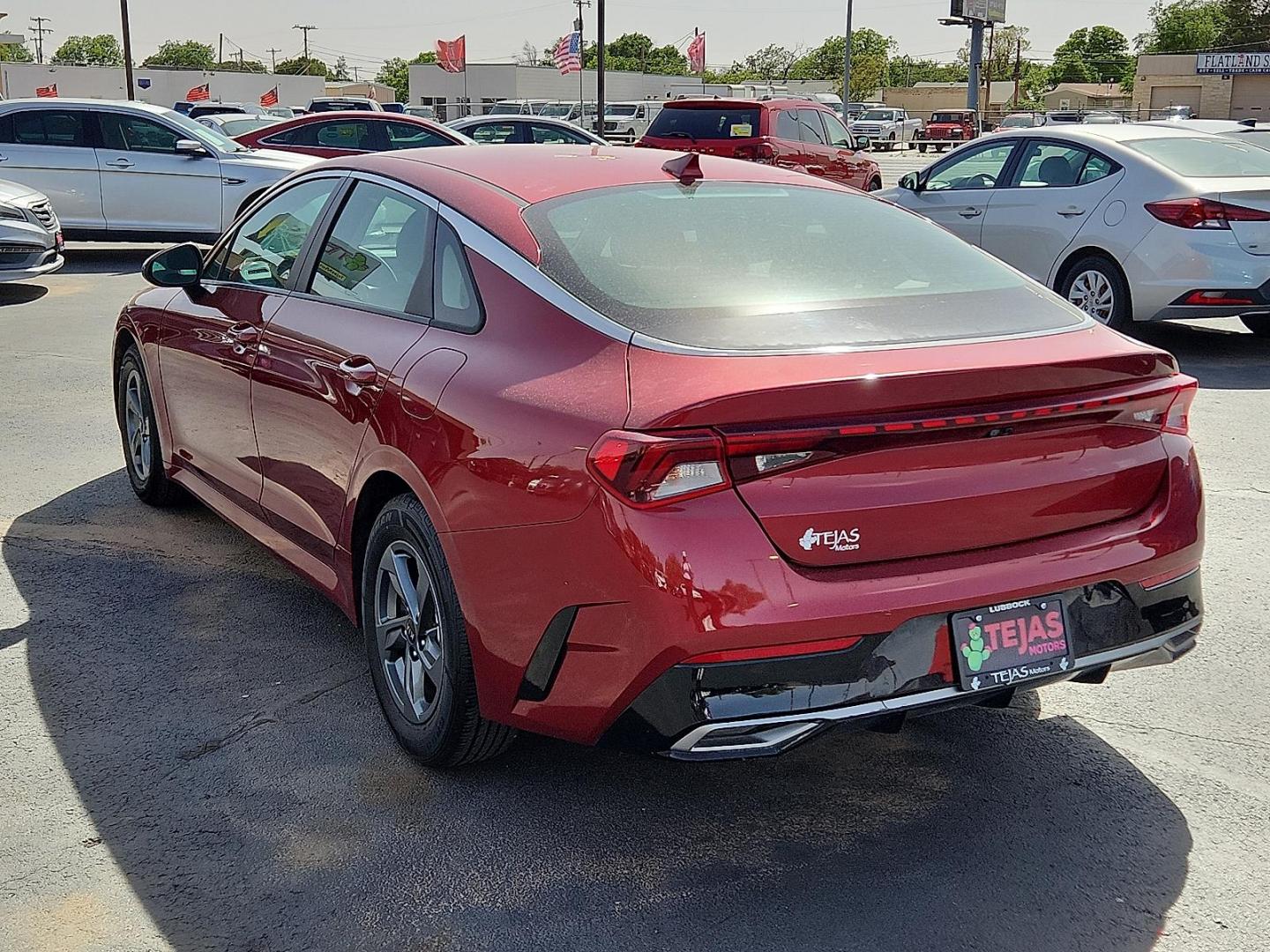 2021 Passion Red Kia K5 LXS (5XXG14J26MG) with an Gamma-II 1.6L I-4 gasoline direct injection, DOHC, CVVD variable valve control, intercooled turbo, regular unleaded, engine with 180HP engine, located at 4110 Avenue Q, Lubbock, 79412, 33.556553, -101.855820 - Photo#2