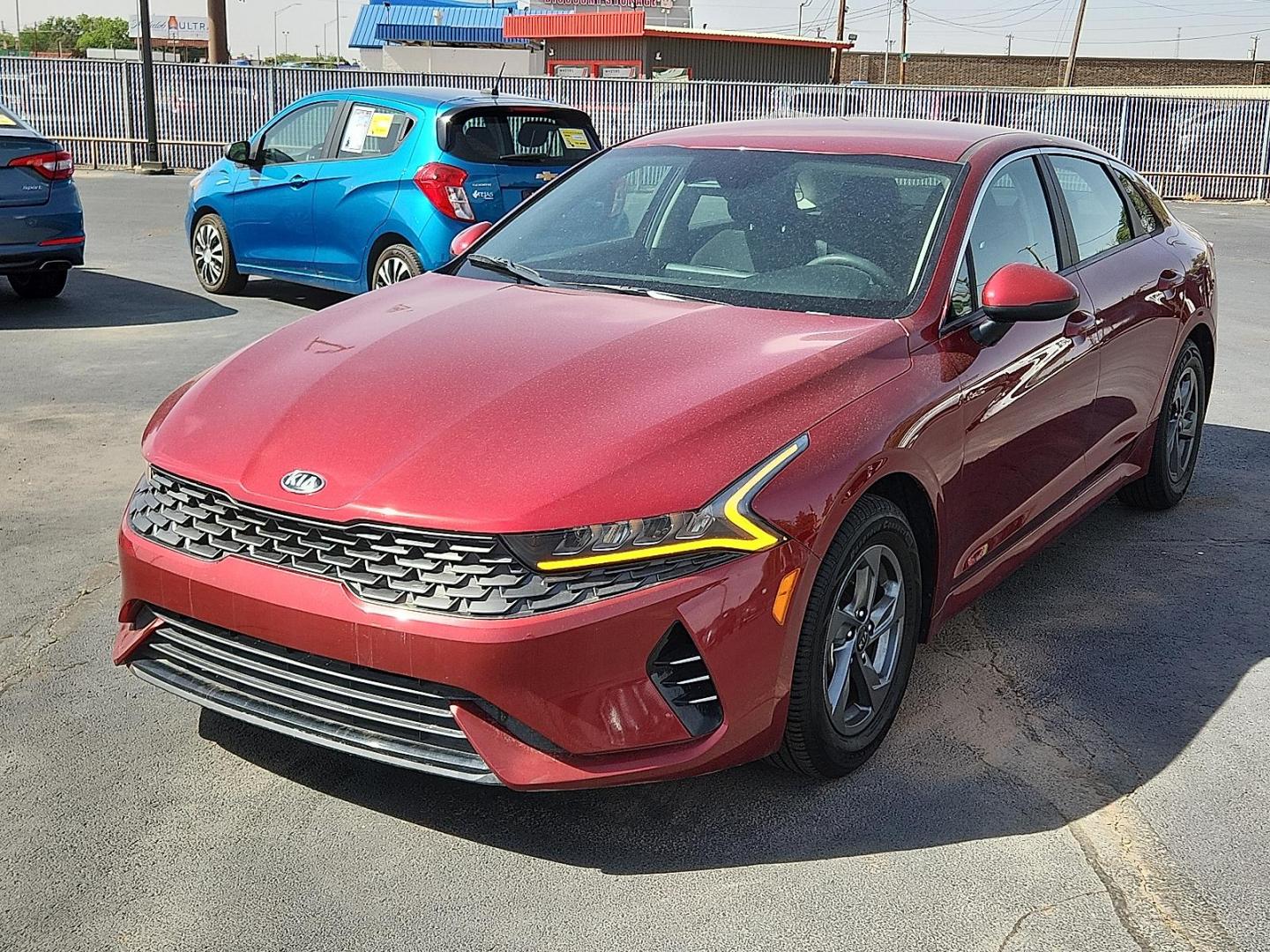 2021 Passion Red Kia K5 LXS (5XXG14J26MG) with an Gamma-II 1.6L I-4 gasoline direct injection, DOHC, CVVD variable valve control, intercooled turbo, regular unleaded, engine with 180HP engine, located at 4110 Avenue Q, Lubbock, 79412, 33.556553, -101.855820 - Photo#3