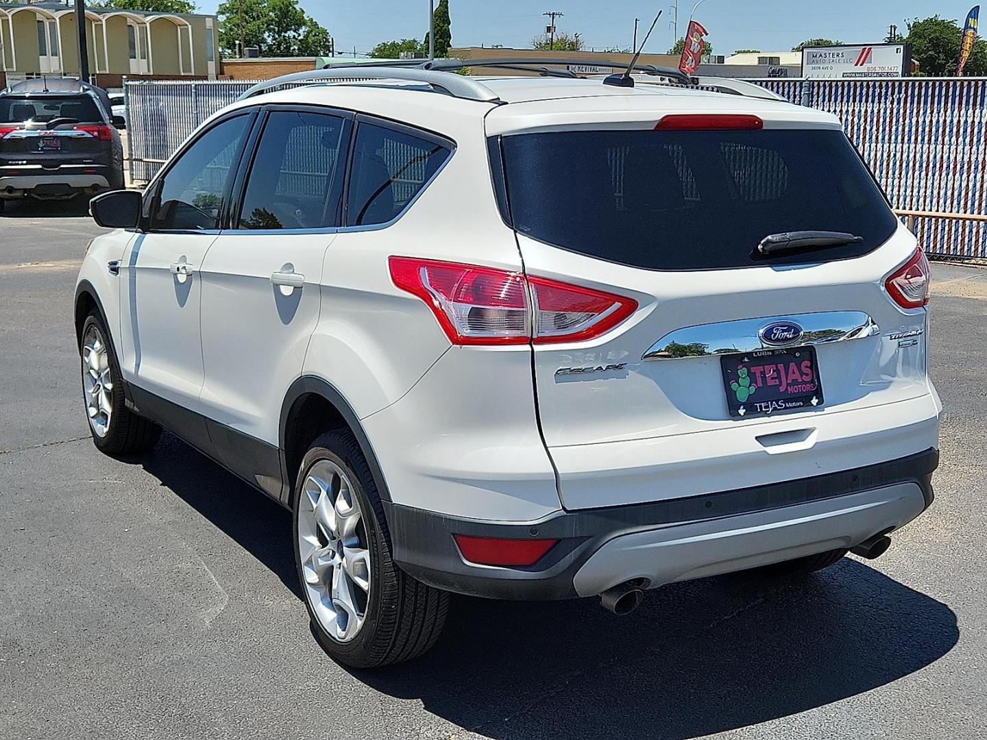 2016 WHITE Ford Escape Titanium (1FMCU9J98GU) with an EcoBoost 2L I-4 gasoline direct injection, DOHC, variable valve control, intercooled turbo, regular unleaded, engine with 240HP engine, located at 4110 Avenue Q, Lubbock, 79412, 33.556553, -101.855820 - 06/05/2025 KEY IN ENVELOPE GOD - Photo#2