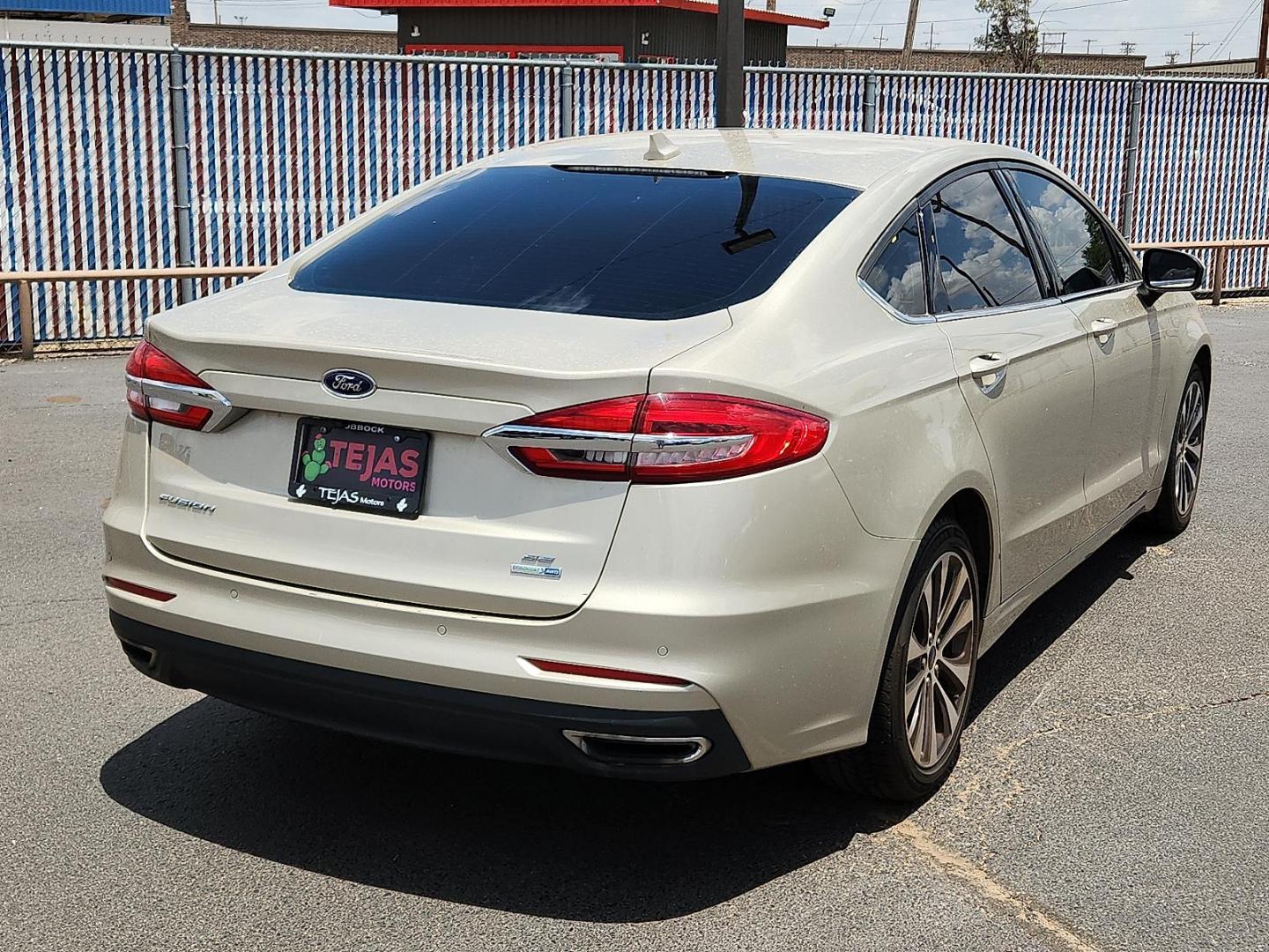 2019 GOLD Ford Fusion SE (3FA6P0T92KR) with an EcoBoost 2L I-4 gasoline direct injection, DOHC, variable valve control, intercooled turbo, premium unleaded, engine with 245HP engine, located at 4110 Avenue Q, Lubbock, 79412, 33.556553, -101.855820 - 06/14/2025 KEY IN ENVELOPE GOD - Photo#1
