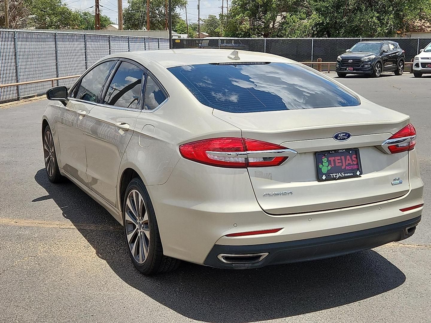 2019 GOLD Ford Fusion SE (3FA6P0T92KR) with an EcoBoost 2L I-4 gasoline direct injection, DOHC, variable valve control, intercooled turbo, premium unleaded, engine with 245HP engine, located at 4110 Avenue Q, Lubbock, 79412, 33.556553, -101.855820 - 06/14/2025 KEY IN ENVELOPE GOD - Photo#2