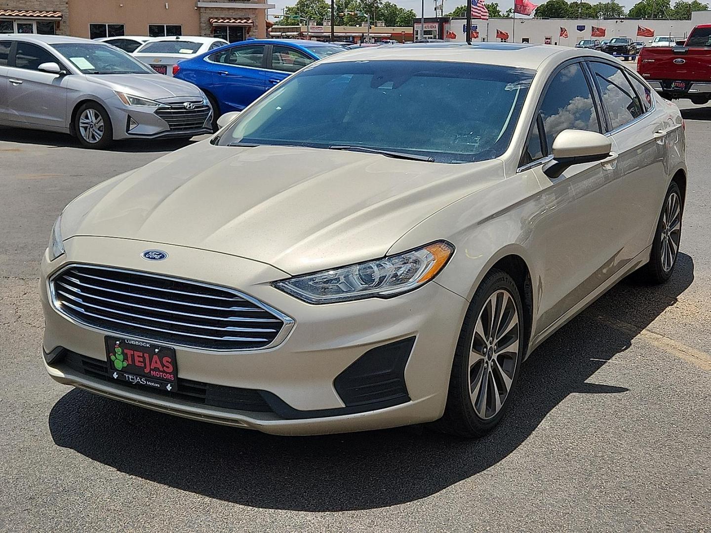 2019 GOLD Ford Fusion SE (3FA6P0T92KR) with an EcoBoost 2L I-4 gasoline direct injection, DOHC, variable valve control, intercooled turbo, premium unleaded, engine with 245HP engine, located at 4110 Avenue Q, Lubbock, 79412, 33.556553, -101.855820 - 06/14/2025 KEY IN ENVELOPE GOD - Photo#3