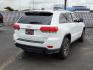 2018 WHITE Jeep Grand Cherokee Laredo E 4x2 (1C4RJEAG1JC) with an Pentastar 3.6L V-6 DOHC, variable valve control, regular unleaded, engine with 293HP engine, located at 4110 Avenue Q, Lubbock, 79412, 33.556553, -101.855820 - 06/21/2025 KEY IN ENVELOPE GOD - Photo#1