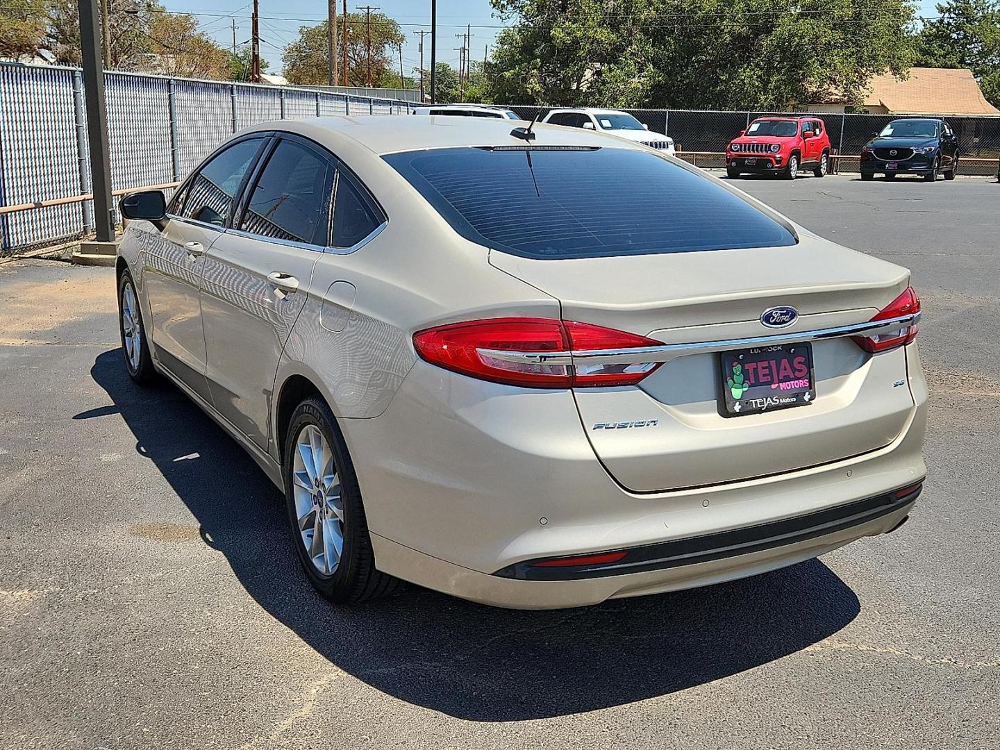 2017 GOLD Ford Fusion SE (3FA6P0H71HR) with an Duratec 2.5L I-4 DOHC, Ti-VCT variable valve control, regular unleaded, engine with 175HP engine, located at 4110 Avenue Q, Lubbock, 79412, 33.556553, -101.855820 - 08/08/2025 KEY IN ENVELOPE GOD - Photo#2