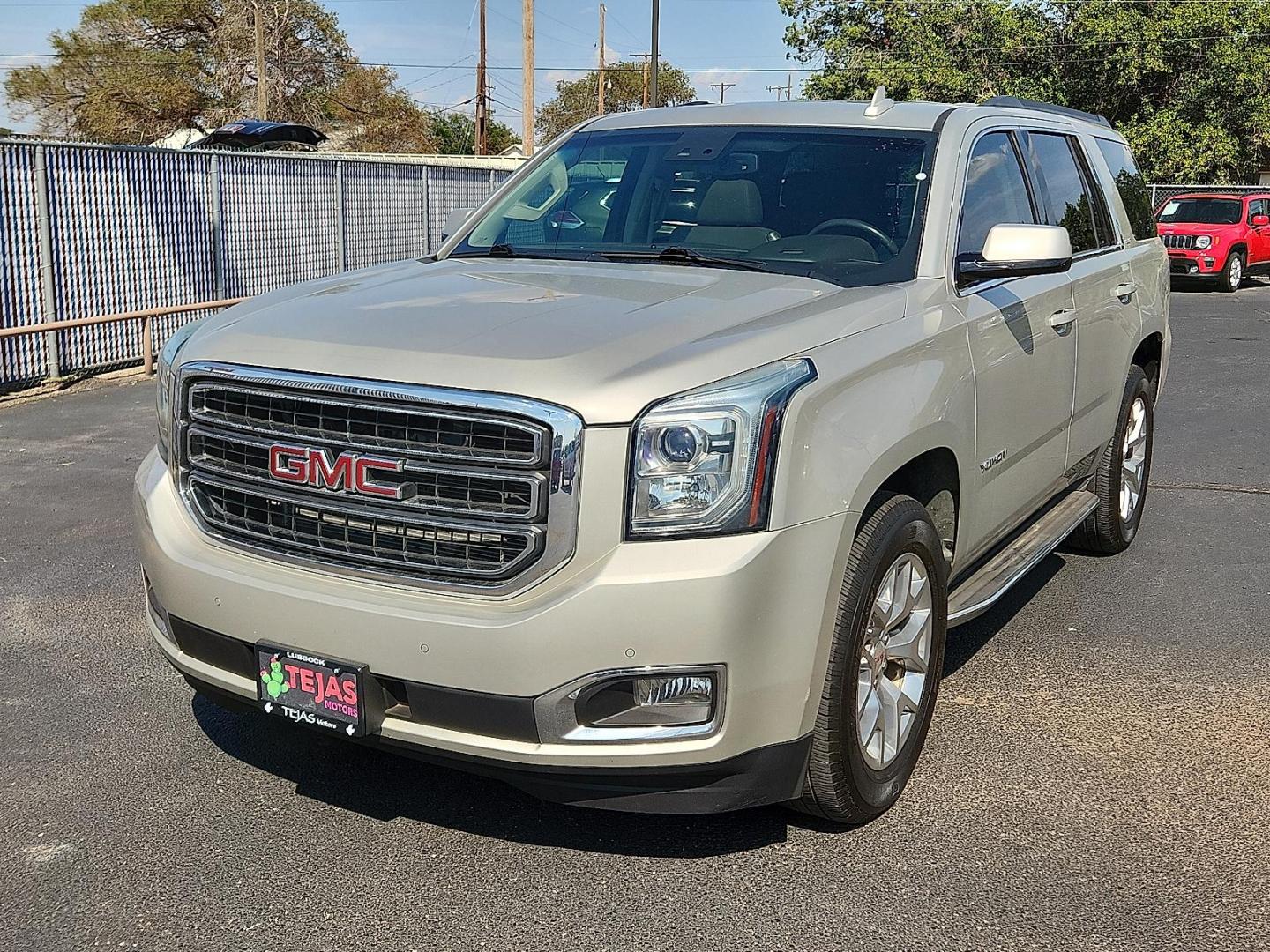 2015 GOLD GMC Yukon SLT (1GKS1BKC8FR) with an EcoTec3 5.3L V-8 gasoline direct injection, variable valve control, regular unleaded, engine with cylinder deactivation and 355HP engine, located at 4110 Avenue Q, Lubbock, 79412, 33.556553, -101.855820 - Photo#1