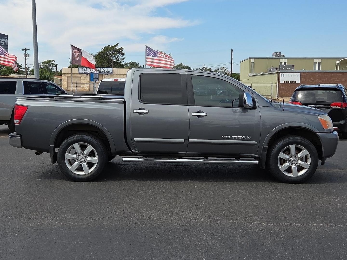 2015 Gun Metallic - KAD /Charcoal - G Nissan Titan SL (1N6BA0EC5FN) with an Endurance 5.6L V-8 DOHC, variable valve control, regular unleaded, engine with 317HP engine, located at 4110 Avenue Q, Lubbock, 79412, 33.556553, -101.855820 - 09/13/2025 KEY IN ENVELOPE GOD - Photo#1