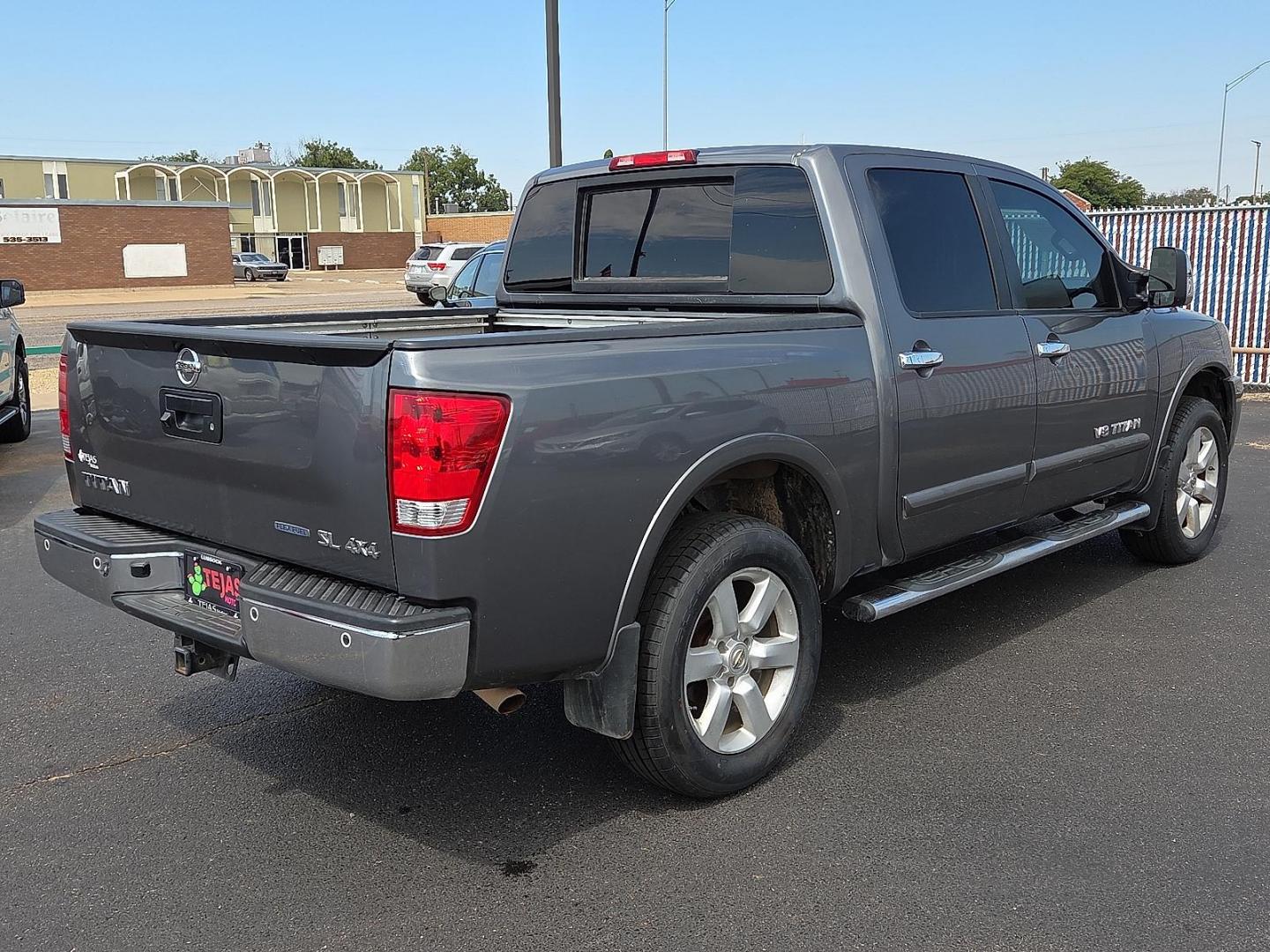 2015 Gun Metallic - KAD /Charcoal - G Nissan Titan SL (1N6BA0EC5FN) with an Endurance 5.6L V-8 DOHC, variable valve control, regular unleaded, engine with 317HP engine, located at 4110 Avenue Q, Lubbock, 79412, 33.556553, -101.855820 - 09/13/2025 KEY IN ENVELOPE GOD - Photo#2