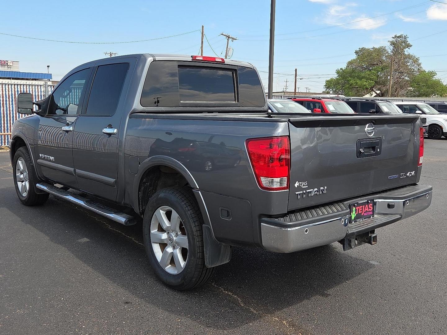 2015 Gun Metallic - KAD /Charcoal - G Nissan Titan SL (1N6BA0EC5FN) with an Endurance 5.6L V-8 DOHC, variable valve control, regular unleaded, engine with 317HP engine, located at 4110 Avenue Q, Lubbock, 79412, 33.556553, -101.855820 - 09/13/2025 KEY IN ENVELOPE GOD - Photo#3