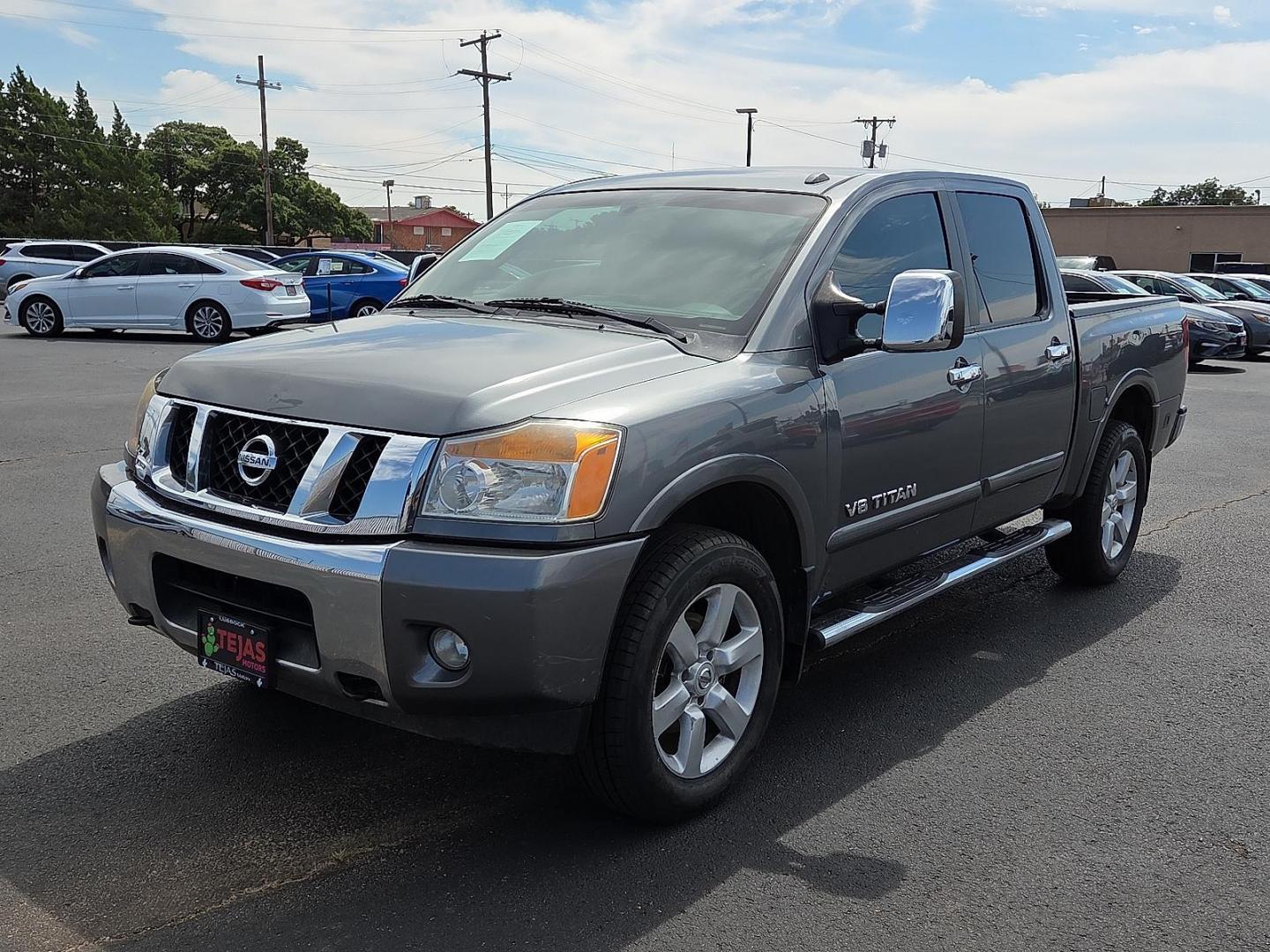 2015 Gun Metallic - KAD /Charcoal - G Nissan Titan SL (1N6BA0EC5FN) with an Endurance 5.6L V-8 DOHC, variable valve control, regular unleaded, engine with 317HP engine, located at 4110 Avenue Q, Lubbock, 79412, 33.556553, -101.855820 - 09/13/2025 KEY IN ENVELOPE GOD - Photo#4
