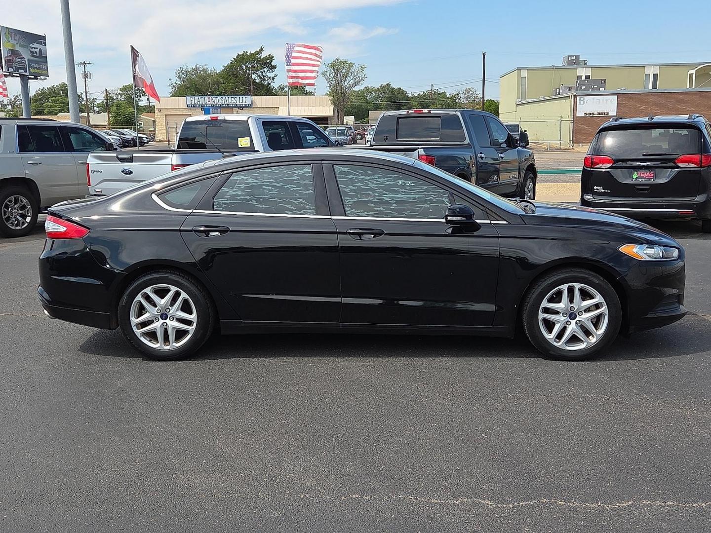 2016 Shadow Black - G1 /Ebony - AW Ford Fusion SE (3FA6P0H74GR) with an Duratec 2.5L I-4 DOHC, iVCT variable valve control, regular unleaded, engine with 175HP engine, located at 4110 Avenue Q, Lubbock, 79412, 33.556553, -101.855820 - 09/13/2025 KEY IN ENVELOPE GOD - Photo#1