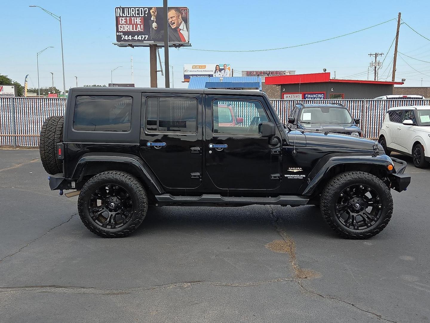 2015 Black Clearcoat - PX8 /Black - X9 Jeep Wrangler Unlimited Sahara (1C4BJWEG1FL) with an 3.6L V-6 DOHC, variable valve control, regular unleaded, engine with 285HP engine, located at 4110 Avenue Q, Lubbock, 79412, 33.556553, -101.855820 - 09/19/2025 KEY IN ENVELOPE GOD - Photo#1