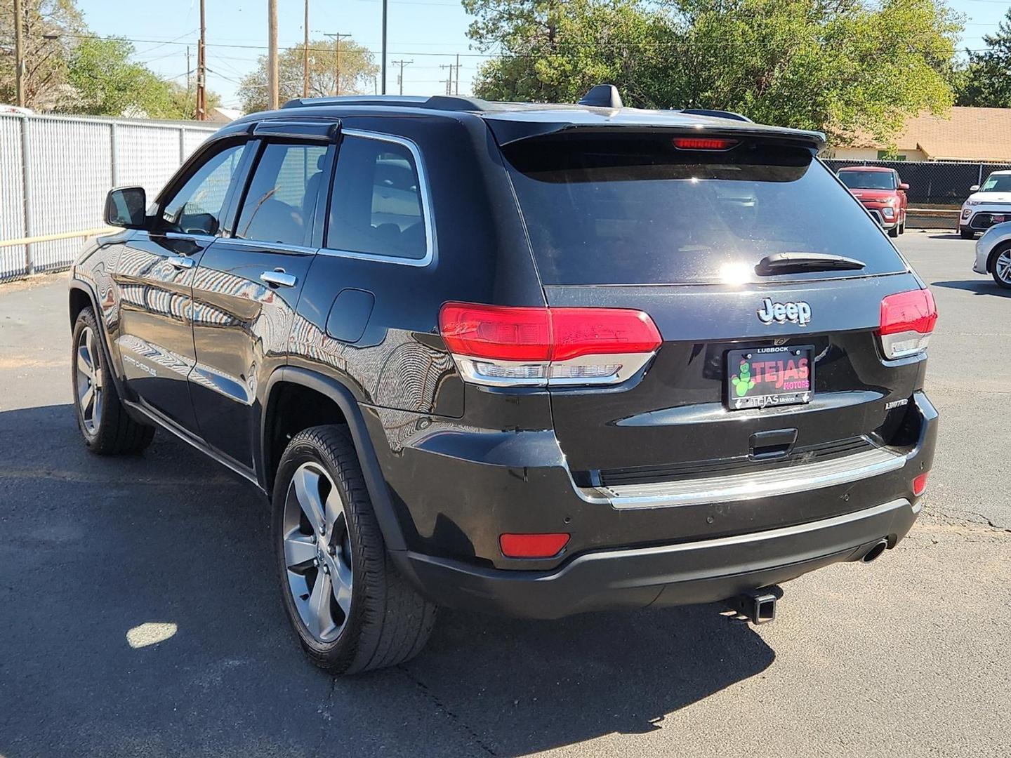 2015 BLACK Jeep Grand Cherokee Limited (1C4RJEBG0FC) with an 3.6L V-6 DOHC, variable valve control, regular unleaded, engine with 290HP engine, located at 4110 Avenue Q, Lubbock, 79412, 33.556553, -101.855820 - Photo#2