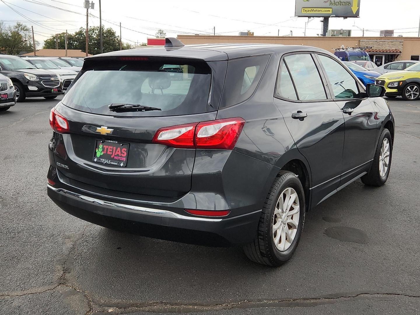 2018 Nightfall Gray Metallic - G7Q /Medium Ash Gray - H72 Chevrolet Equinox LS (2GNAXHEV1J6) with an 1.5L I-4 gasoline direct injection, DOHC, VVT variable valve control, intercooled turbo, regular unleaded, engine with 170HP engine, located at 4110 Avenue Q, Lubbock, 79412, 33.556553, -101.855820 - Photo#1