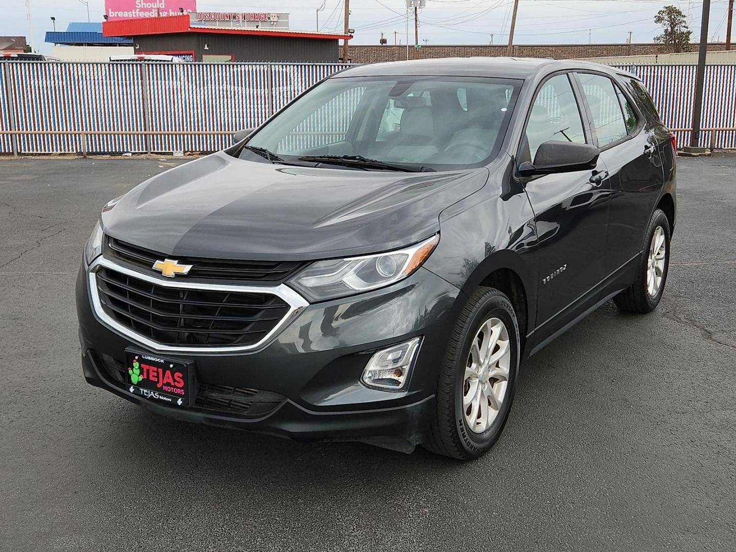 2018 Nightfall Gray Metallic - G7Q /Medium Ash Gray - H72 Chevrolet Equinox LS (2GNAXHEV1J6) with an 1.5L I-4 gasoline direct injection, DOHC, VVT variable valve control, intercooled turbo, regular unleaded, engine with 170HP engine, located at 4110 Avenue Q, Lubbock, 79412, 33.556553, -101.855820 - Photo#3