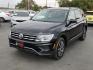 2020 Deep Black Pearl - 2T2T /Titan Black - BV Volkswagen Tiguan 2.0T SE (3VV3B7AX0LM) with an 2L I-4 gasoline direct injection, DOHC, variable valve control, intercooled turbo, regular unleaded, engine with 184HP engine, located at 4110 Avenue Q, Lubbock, 79412, 33.556553, -101.855820 - Photo#3