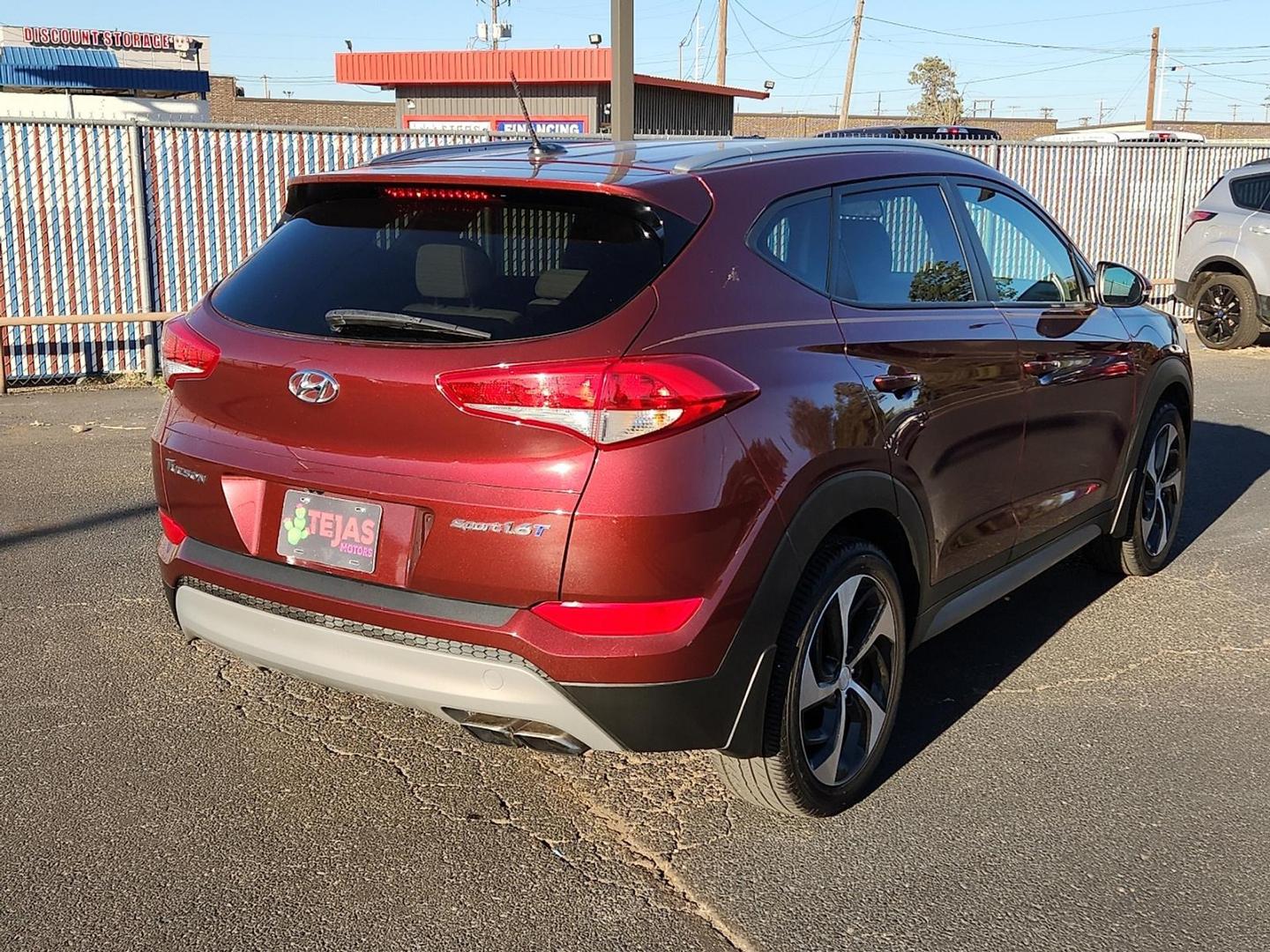 2017 RED Hyundai Tucson Sport (KM8J33A21HU) with an 1.6L I-4 gasoline direct injection, DOHC, D-CVVT variable valve control, intercooled turbo, regular unleaded, engine with 175HP engine, located at 4110 Avenue Q, Lubbock, 79412, 33.556553, -101.855820 - 11/06/2025 KEY IN ENVELOPE GOD - Photo#1